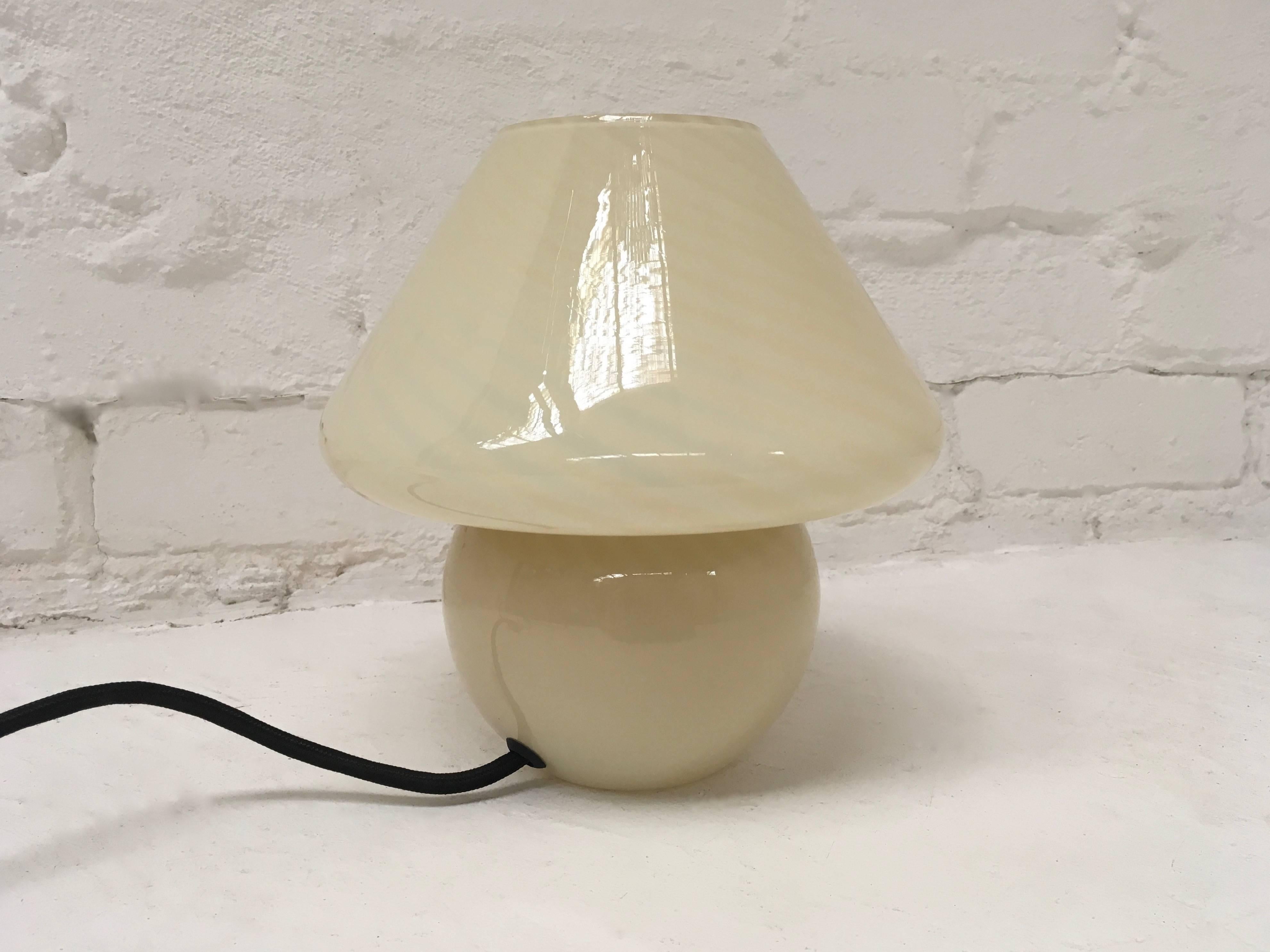 This sweet little lamp is perfect for the bedside but can do good things on a living room table as well. It casts a beautiful warm glow and has a soothing lighting effect as there's no light or shade contrast, just warm, beautiful, glowing Murano