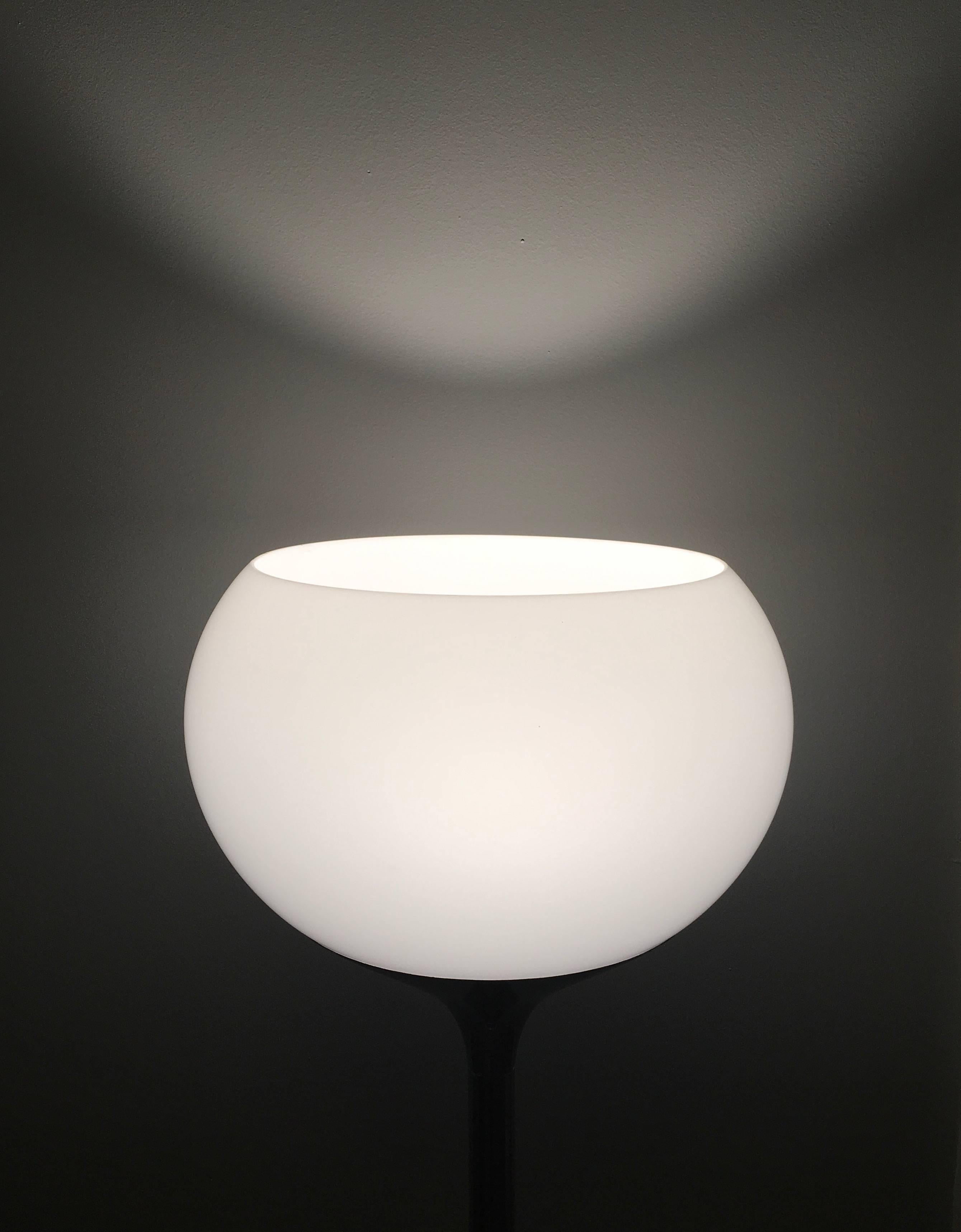 A fabulous floor lamp in glowing chrome and luminous plastic. Casts a typical Guzzini glow of softly diffused light, this one has a touch of pearly lustre in the plastic shade. 

This lamp has an in line foot switch. Rewired, tested and tagged to