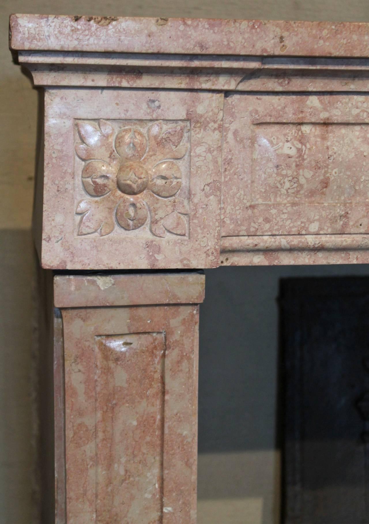 Beautiful Louis XVI marblestone fireplace.