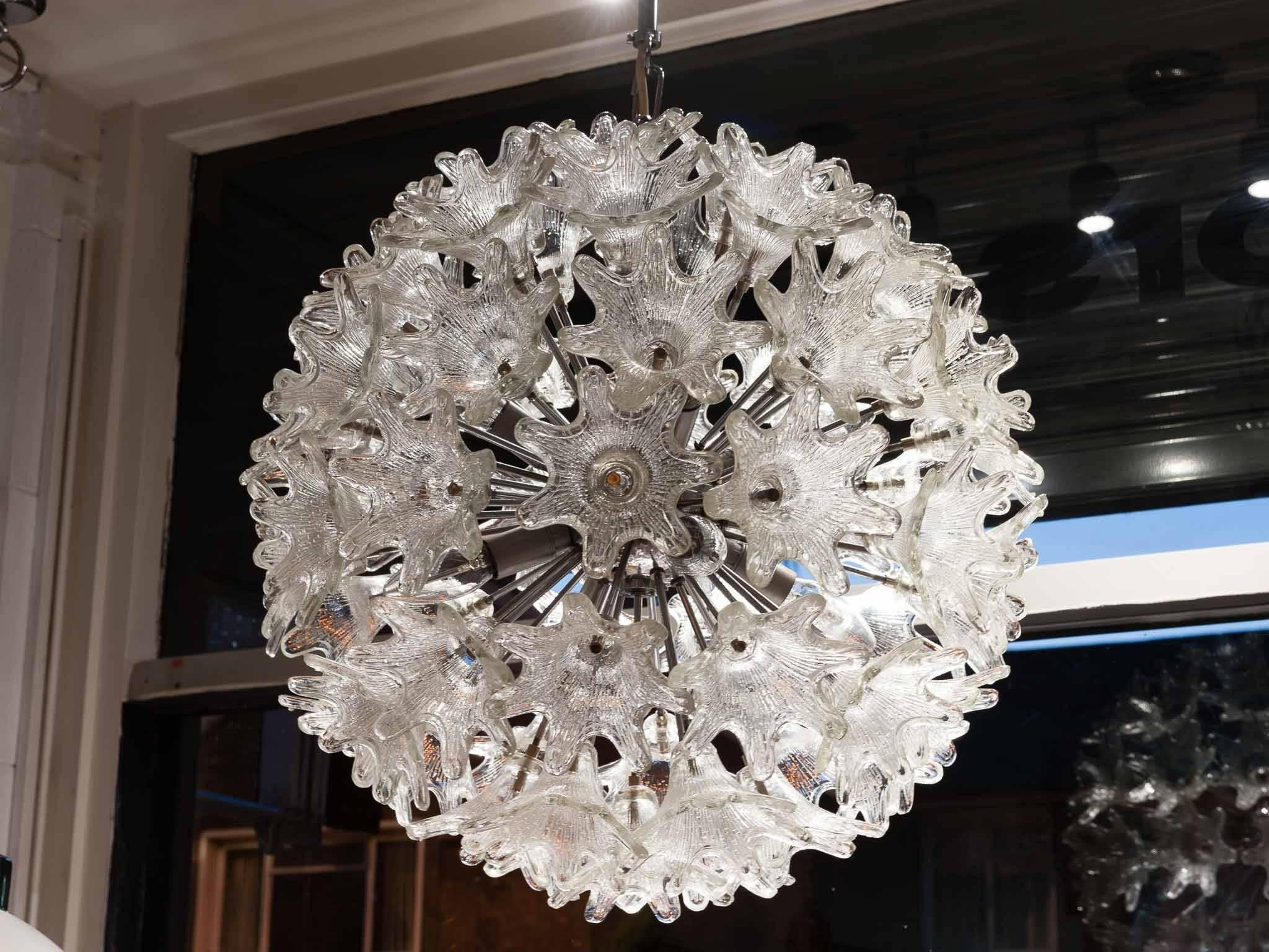 Italian Mid-Century Modern Murano floral Sputnik chandelier with textured clear glass flowers designed by Mazzega in the 1960s. The chandelier features a chrome-plated metal frame with handblown Murano glass flowers suspended on rods that interlock