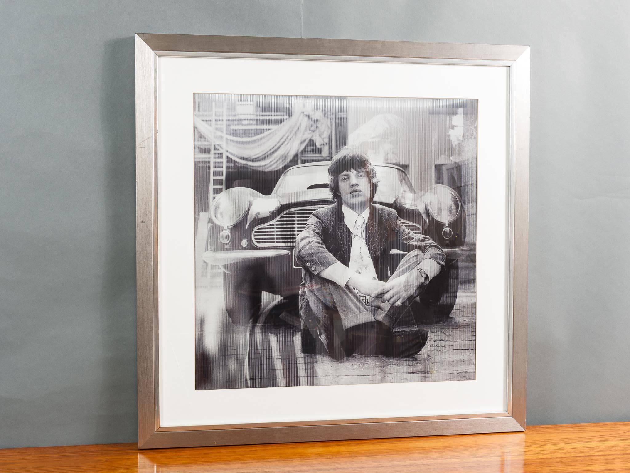 Large lenticular showing four different images of the Rolling Stone's Mick Jagger in the 1960s. Designed by Matthew Andrews. An amazing and striking piece in a silver frame.
