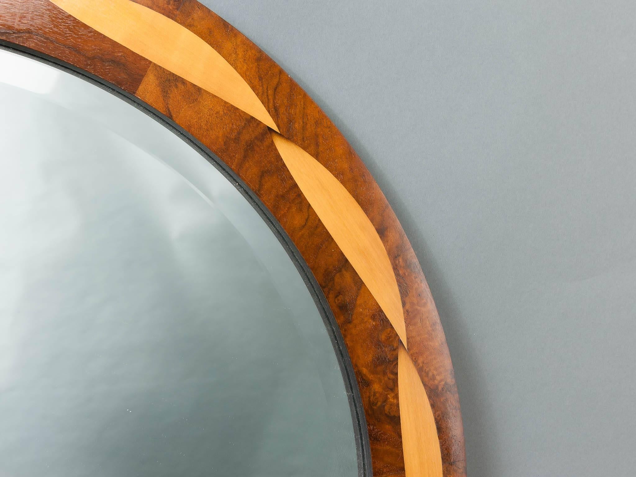 Toby Winteringham 'Plexus' round mirror with a simple yet beautiful inlaid lazy twist of sand shaded Sycamore on a contrasting background timber of Indian rosewood. Perfect for above a mantelpiece or in a hallway.

From a barn on the outskirts of