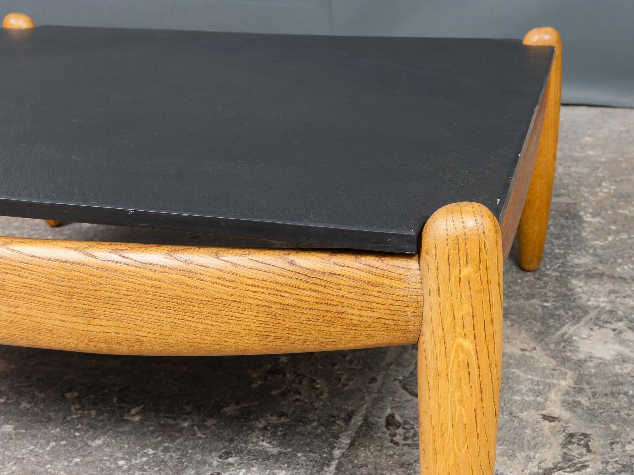 A wonderful pair of 1960s German vintage oak and slate coffee tables by Straub. Their original label is attached to the underneath of the heavy solid slate tops. Very stylish and beautifully sculpted. Made from a solid oak frame with an extremely