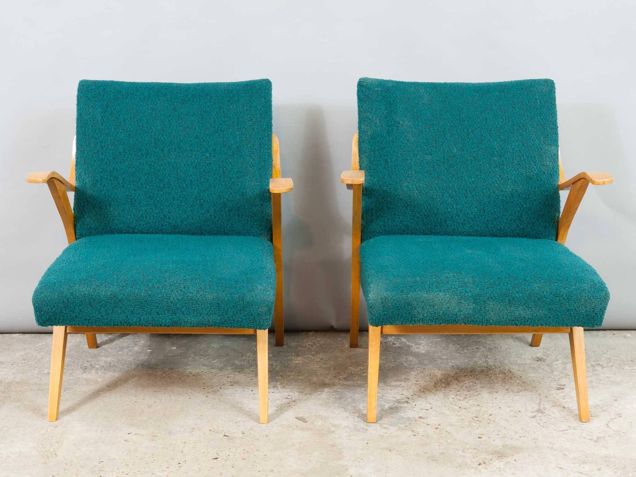 1960s Czech beech armchairs by Tatra Nabytok in their original teal fabric. The wooden parts of the chairs have been refinished and have a lovely polished patina. The original fabric does show some signs of wear commensurate to their age and past