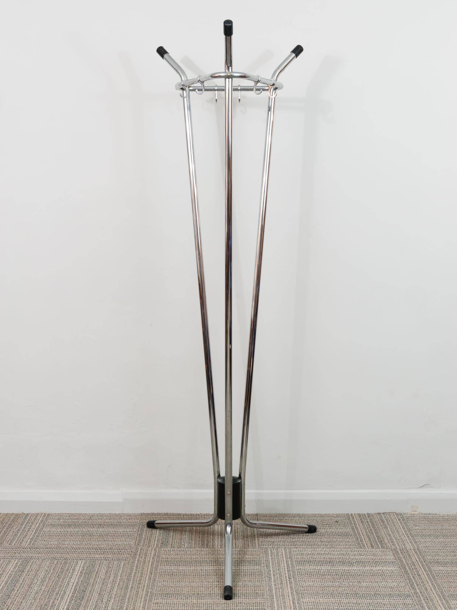 A beautifully designed, functional, freestanding coat stand. Manufactured in the 1960s by Tubax of Belgium for the Zaventem Airport. The rack is formed from three tubular vertical chrome tubes which flare at the bottom to create the legs and at the