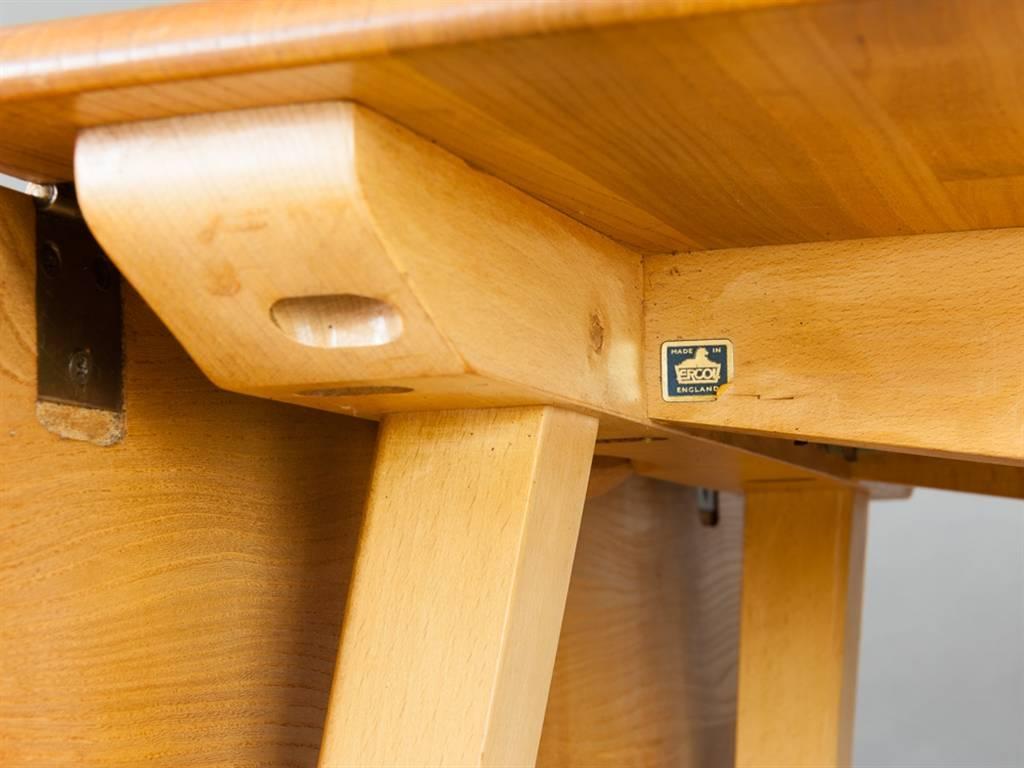 Vintage Classic Ercol 'Windsor' drop leaf dining table model 383. The elm tabletop sits on splayed Beech legs. The elm top has a wonderful golden patina and has been beautifully restored and repolished. A vintage Classic which is very practical and