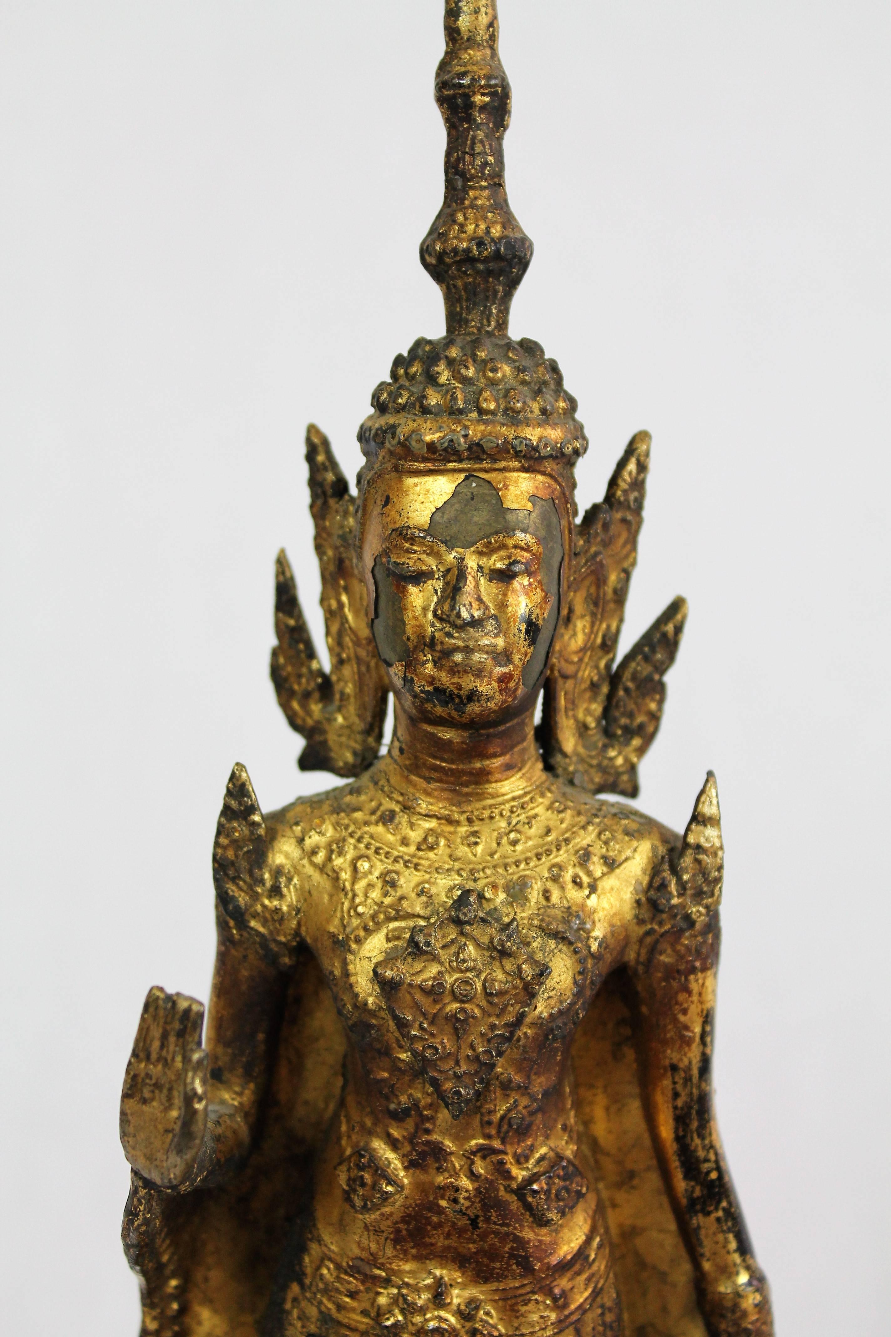 Paang Harm Samoot Buddha (Monday Buddha). Guilt-lacquered bronze statuette of adorned Buddha standing on a lotus flower.
Thailand, Rattanakosin period 19th century
Provenance: French private collection.