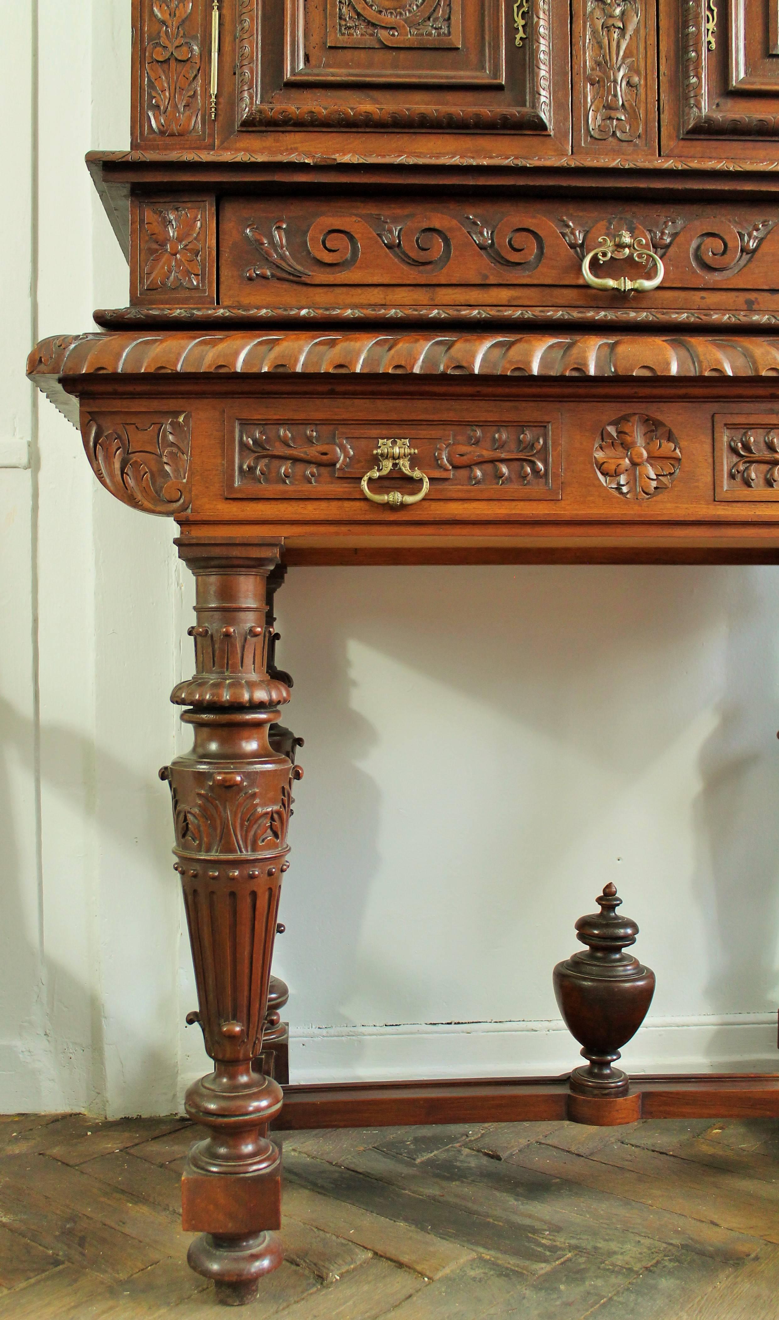 Very nice 19th century Renaissance style cabinet in richly carved walnut hand-carved with some elements of furniture of the 16th century on its upper part. The upper part has two doors to the initials of the sponsor of the furniture with their