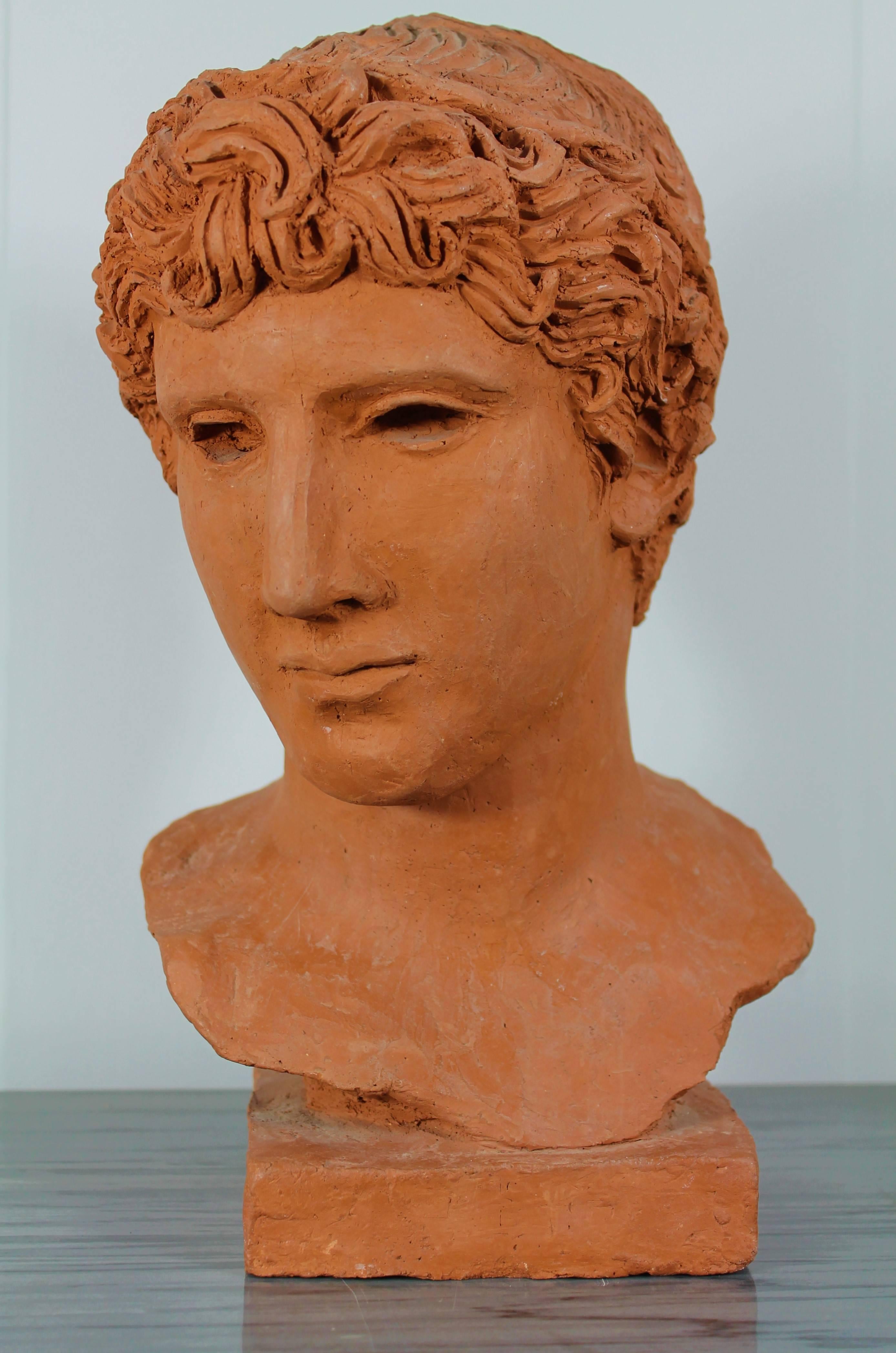 Beautiful bust of an ephebe in terra cotta in the manner of the ancient. Unique piece by Morin Dry (Signed M.M),
circa 1940.