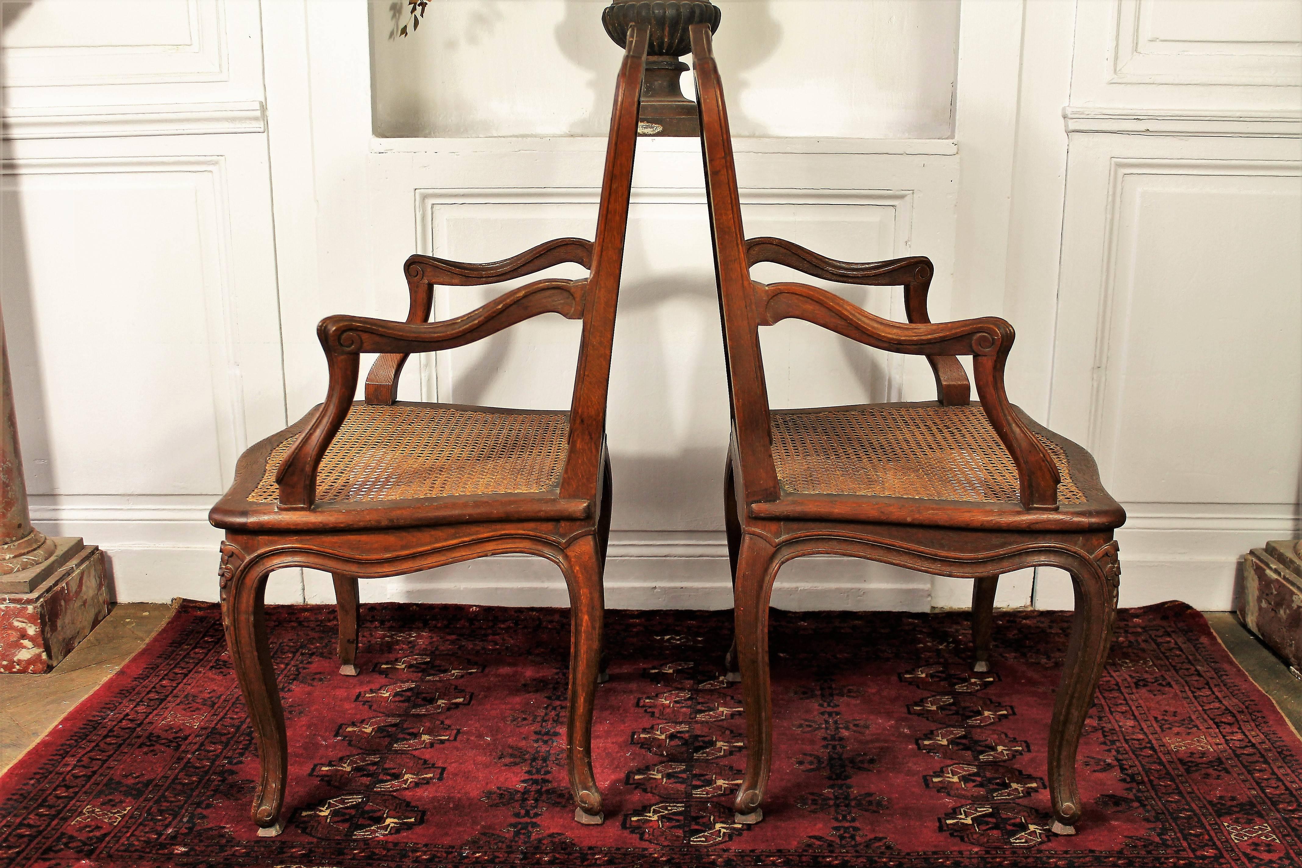 Pair of Louis XV style hand-carved armchairs in oak, seat and back caning.
France;
Second part of the 19th century.