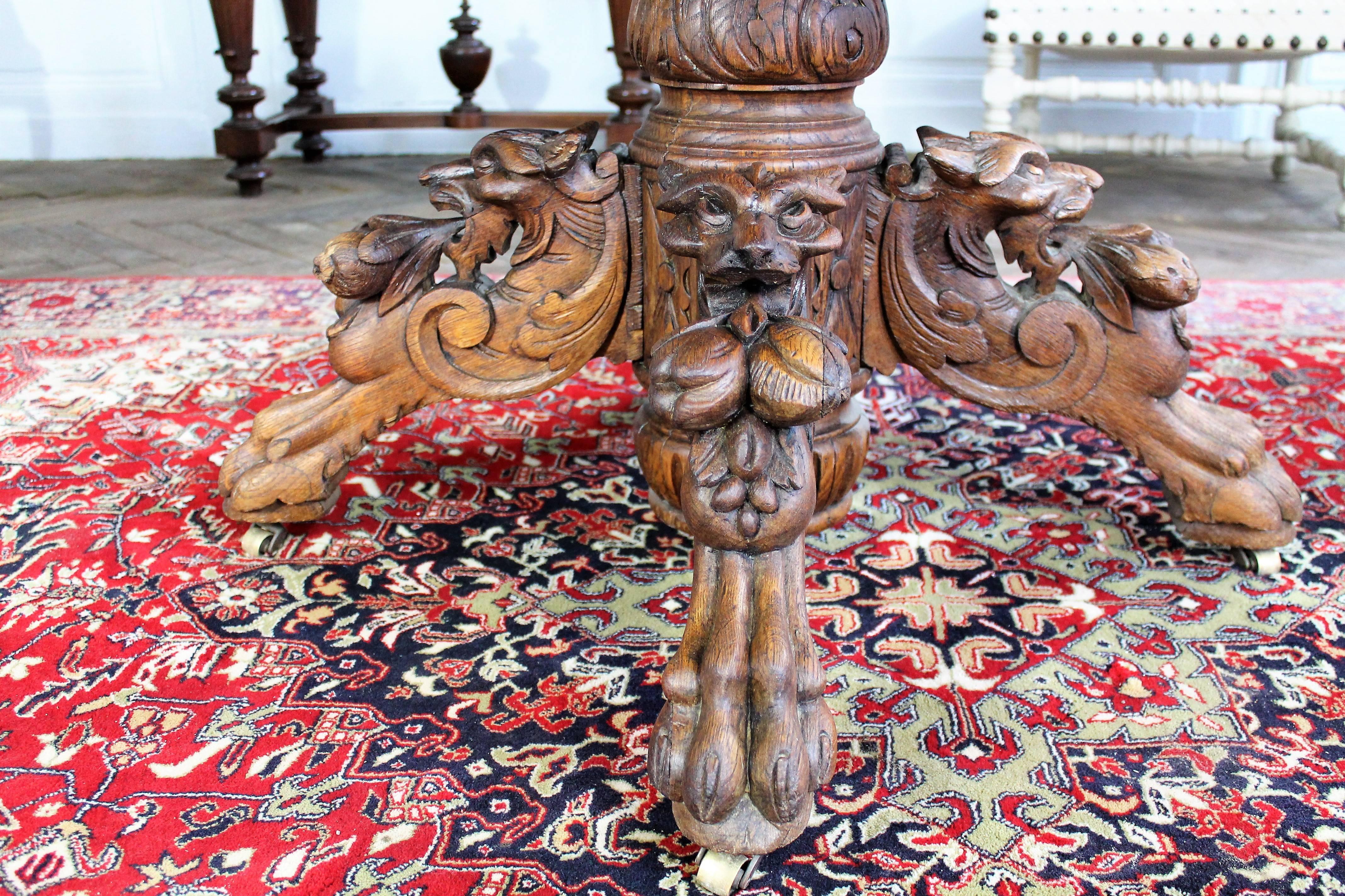 Neo Renaissance oak table with hand-carved lion head base.
Mounted on wheels.
Late 19th century.
France.