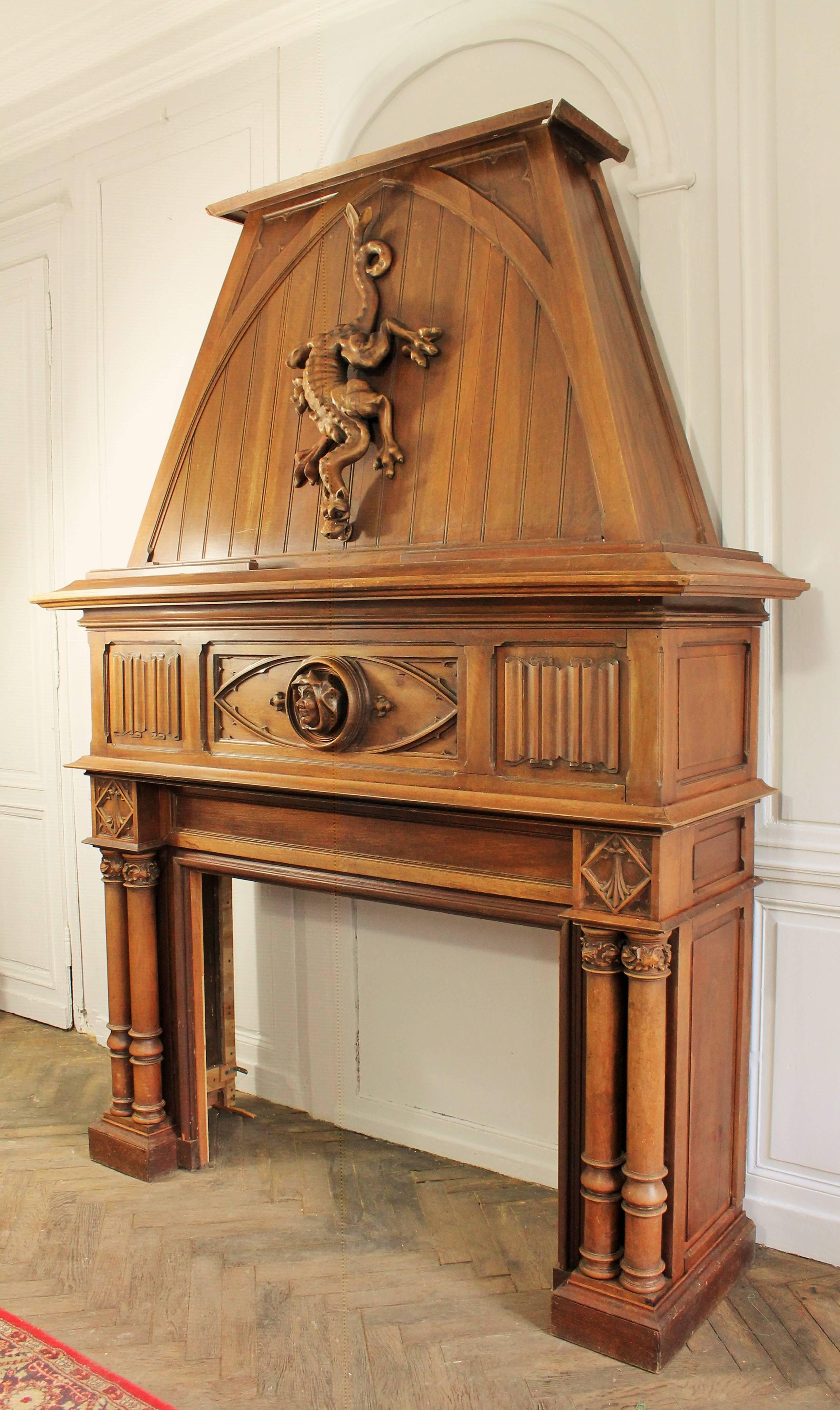 Oak Gothic Revival Fireplace with its Hood and Carved Salamander, Witch and Ermine For Sale