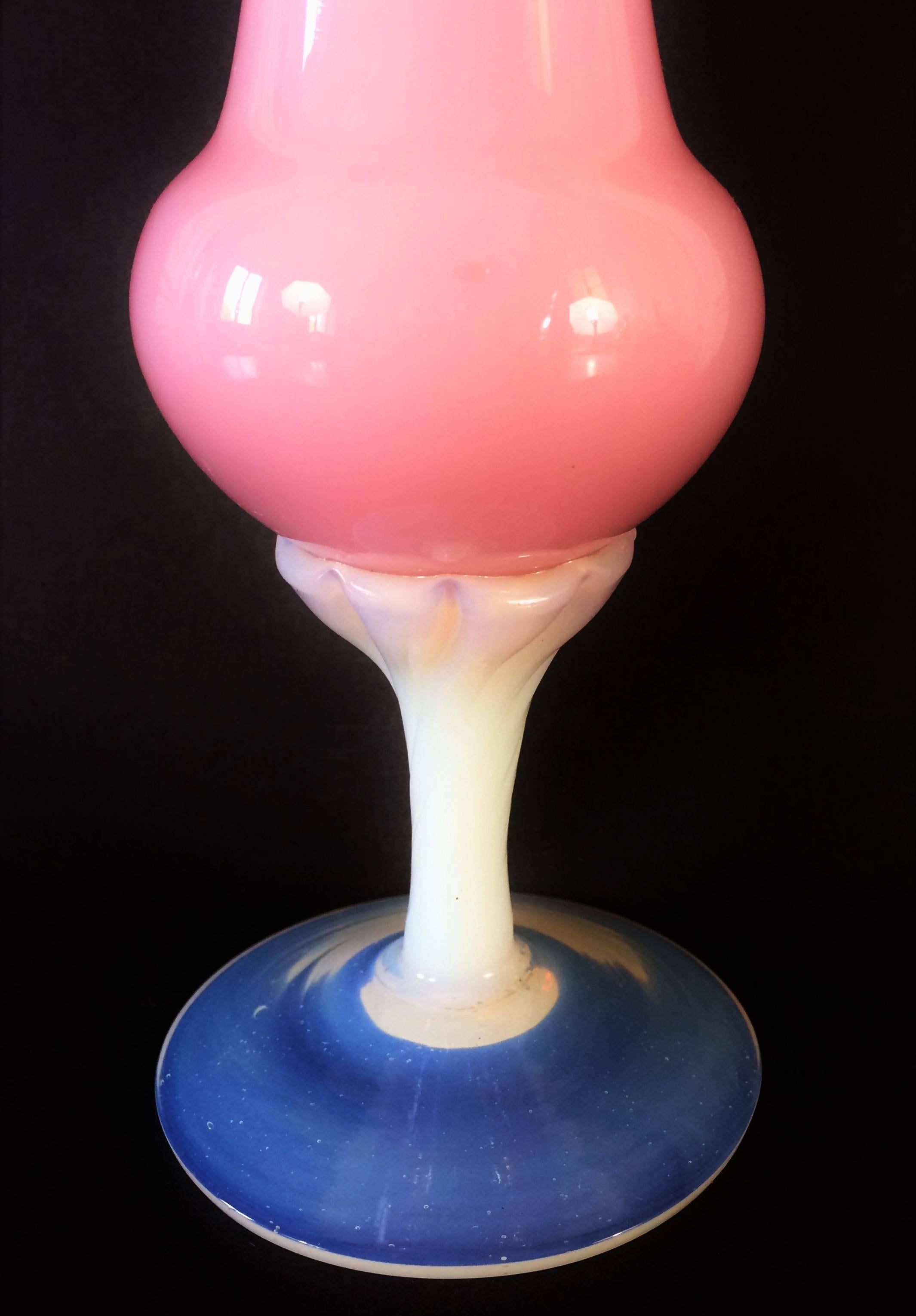 Vase on pedestal in pink opal glass.
Blue feet.
France early 20th century. Art Deco period.
Very nice french work.

Opaline or opaline glass is a type of white or colored, opaque or translucent glass that can be blown or pressed into a wide variety