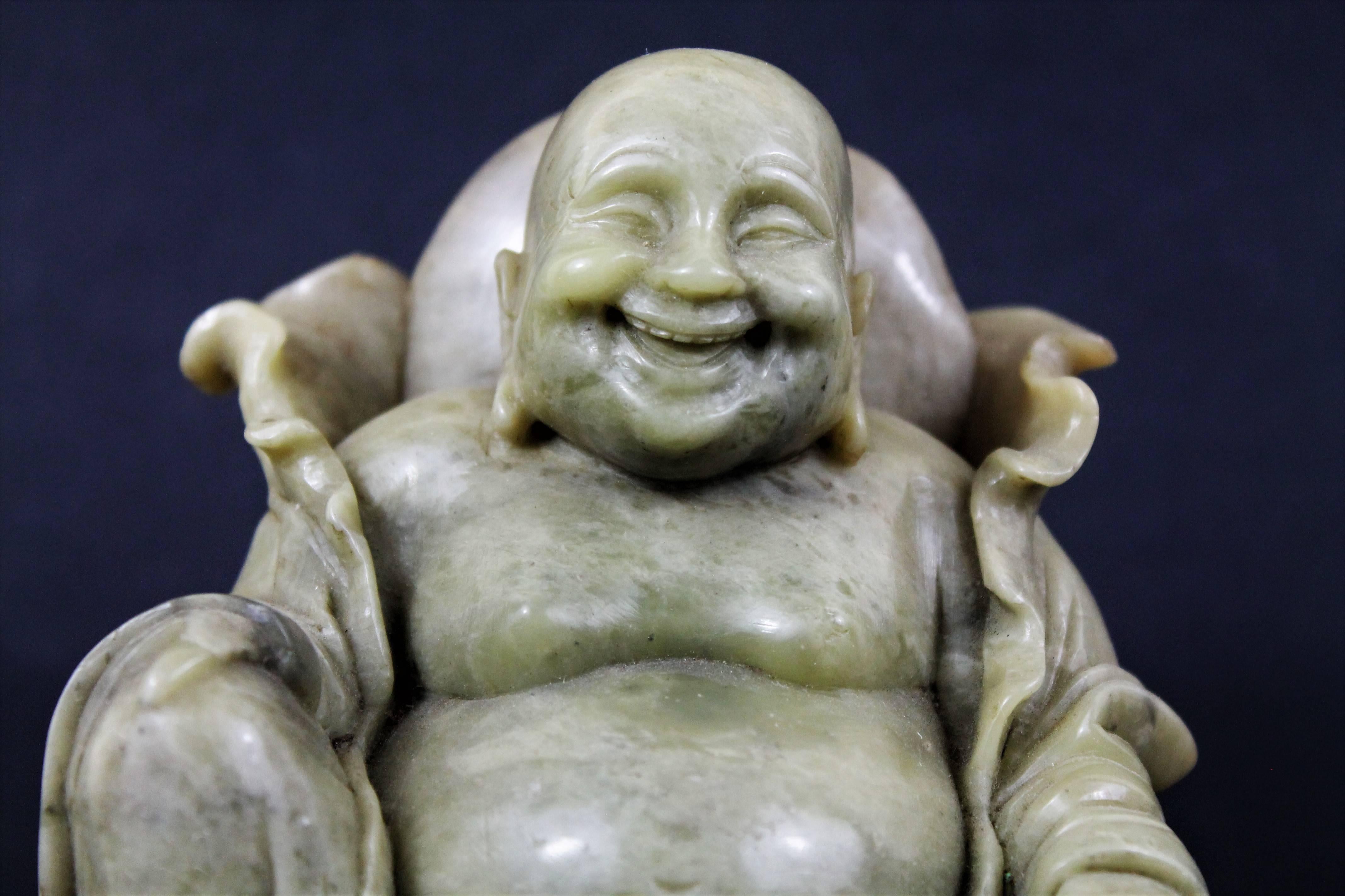 Nice soapstone sculpture representing sitting Budai, the face is finely carved. Very good quality of execution
The laughing Buddha or Budai is the he god of contentment and happiness, guardian of children, and patron of bartenders. Budai has a