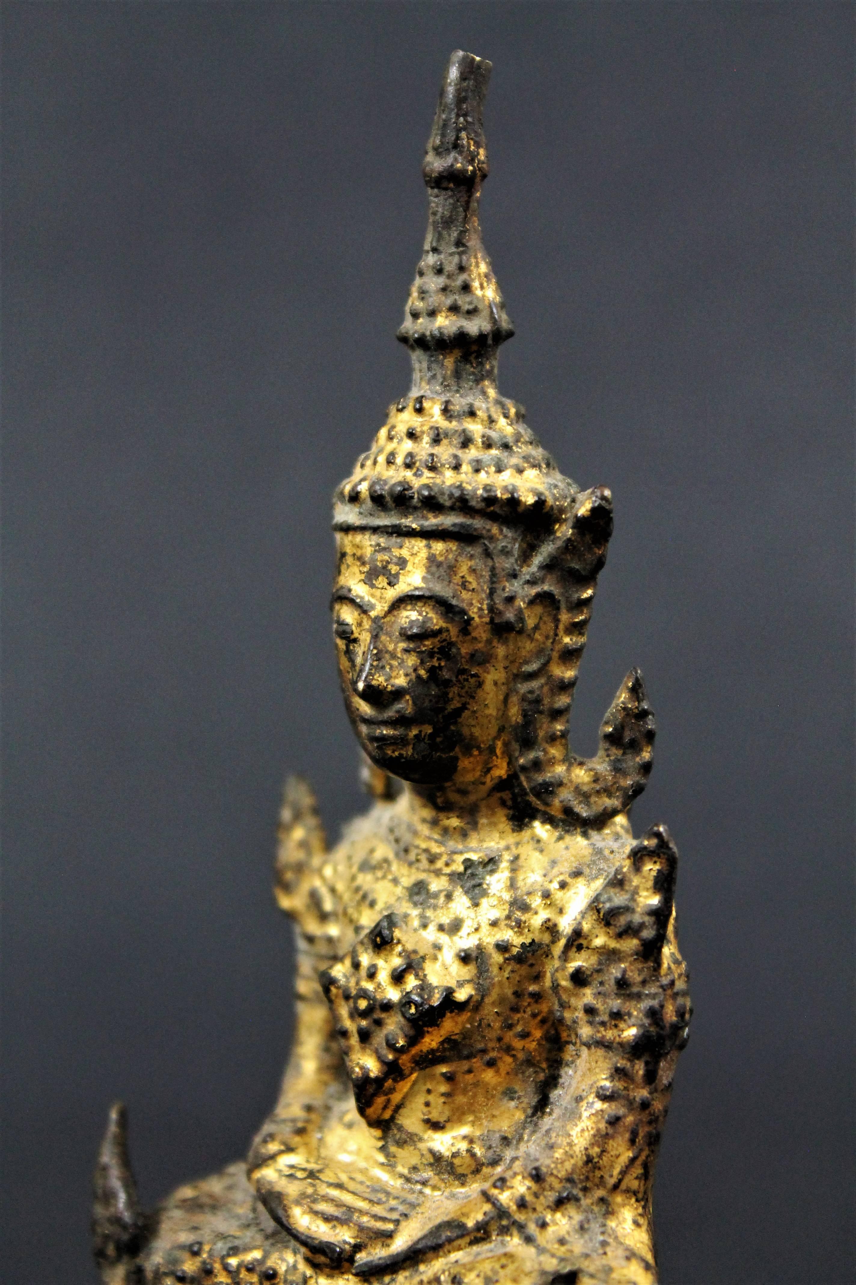  19th Century Thai Siam Rattanakosin Buddha
Guilt-Lacquered Bronze Buddha seated in deep meditation (Virasana) on a stepped throne. The Unisa or flame above the head symbolizes attainment of Nirvana or is indicative of supreme knowledge. 

