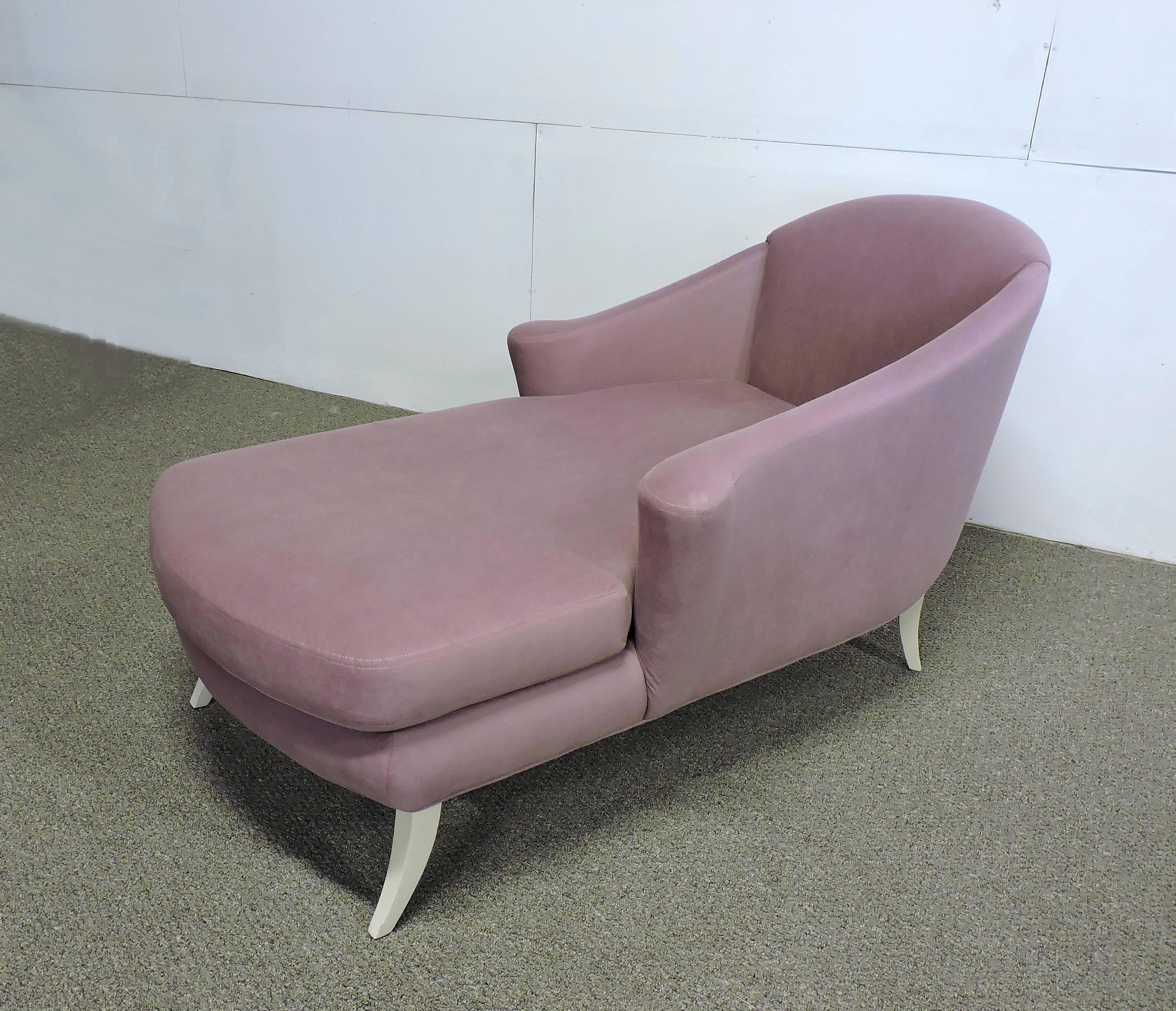 Lovely chaise longue made by high quality furniture manufacturer, Thayer Coggin. This chaise has beautiful curves with white lacquered saber feet and is upholstered in a lilac colored microsuede fabric.