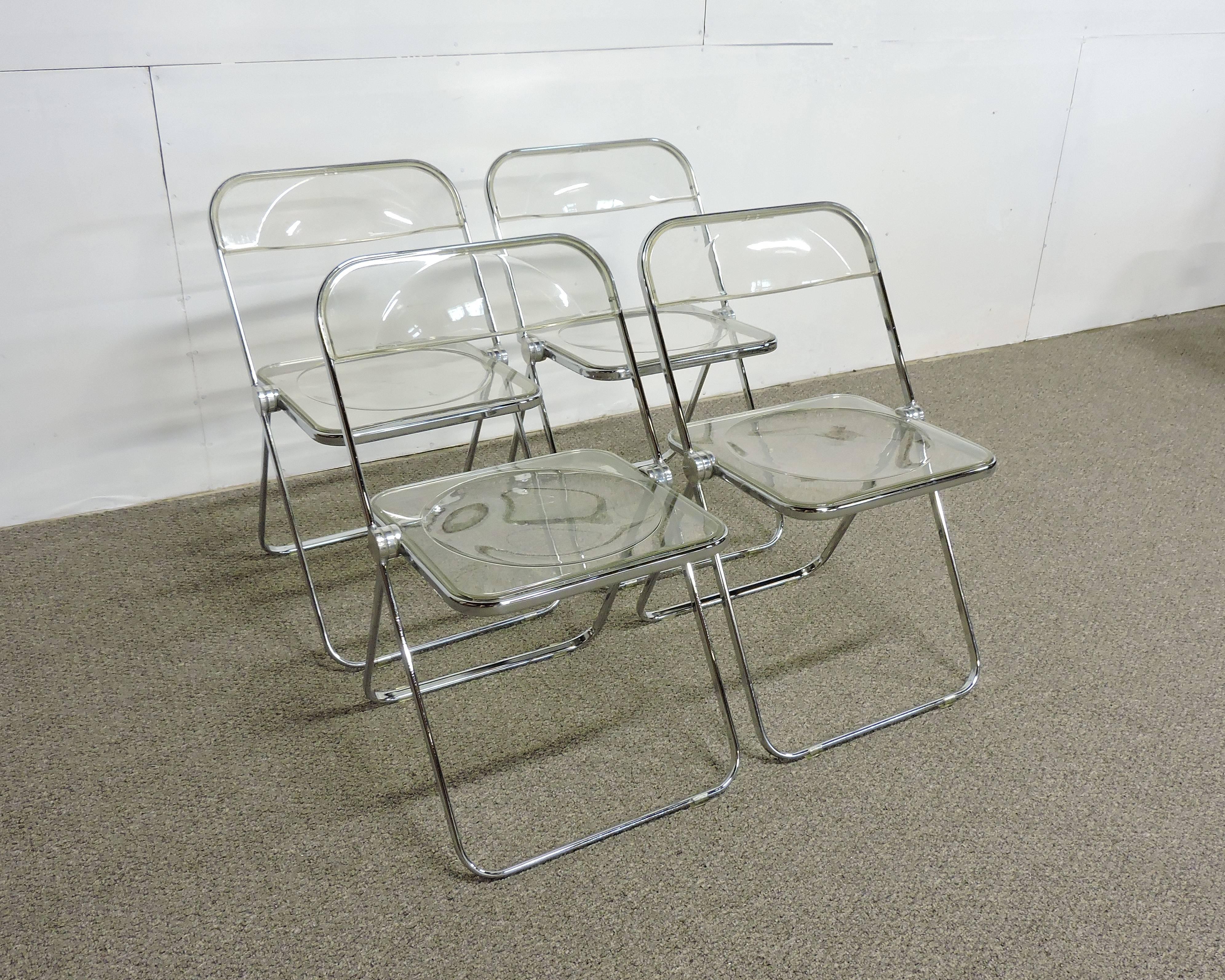 Set of four original 1960s Plia chairs designed by Giancarlo Piretti and made in Italy by Anonima Castelli. Winner of several design awards and the most stylish folding chairs that you'll ever own! The innovative three disc hinge allows these to be