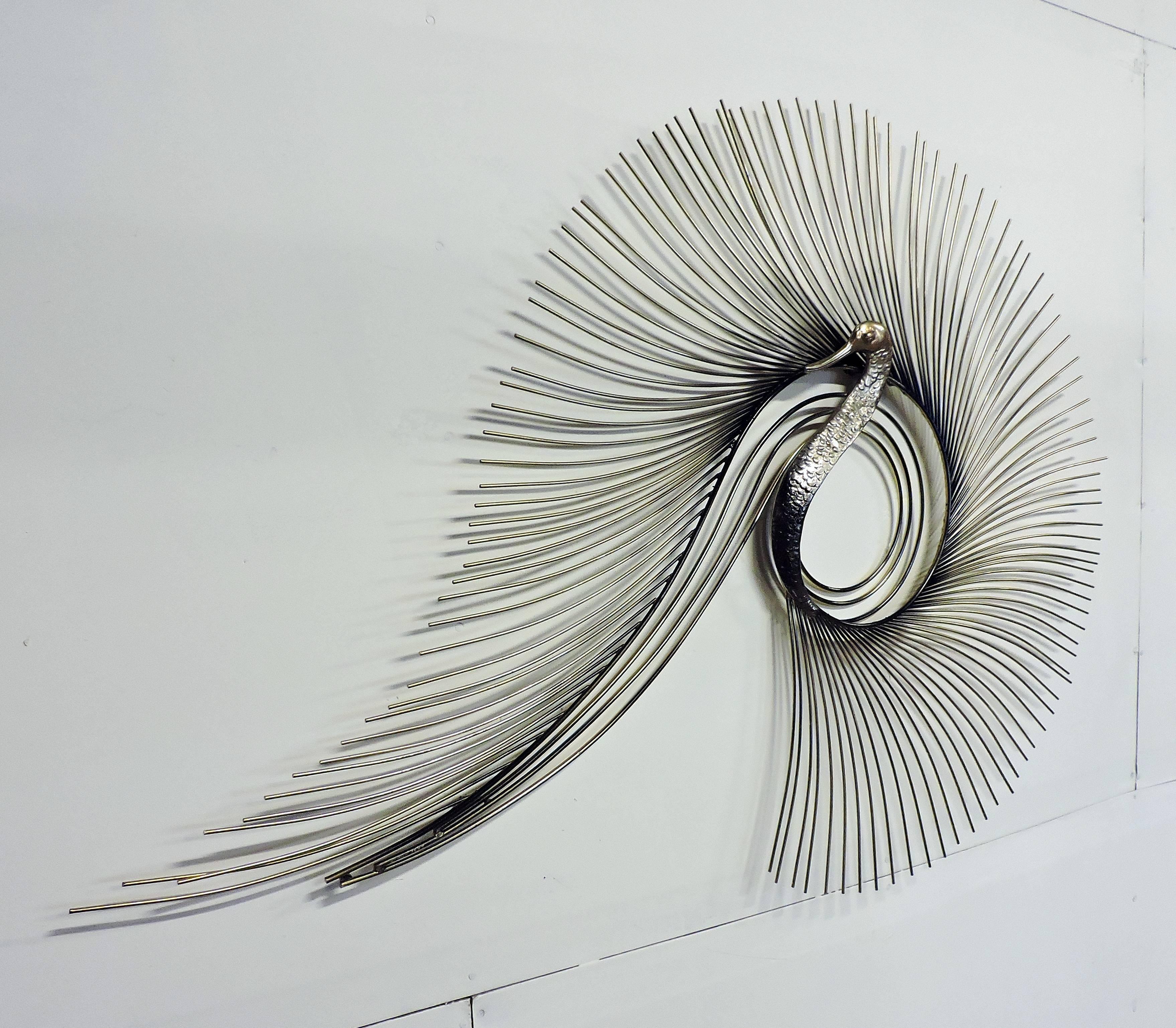 brass peacock wall hanging