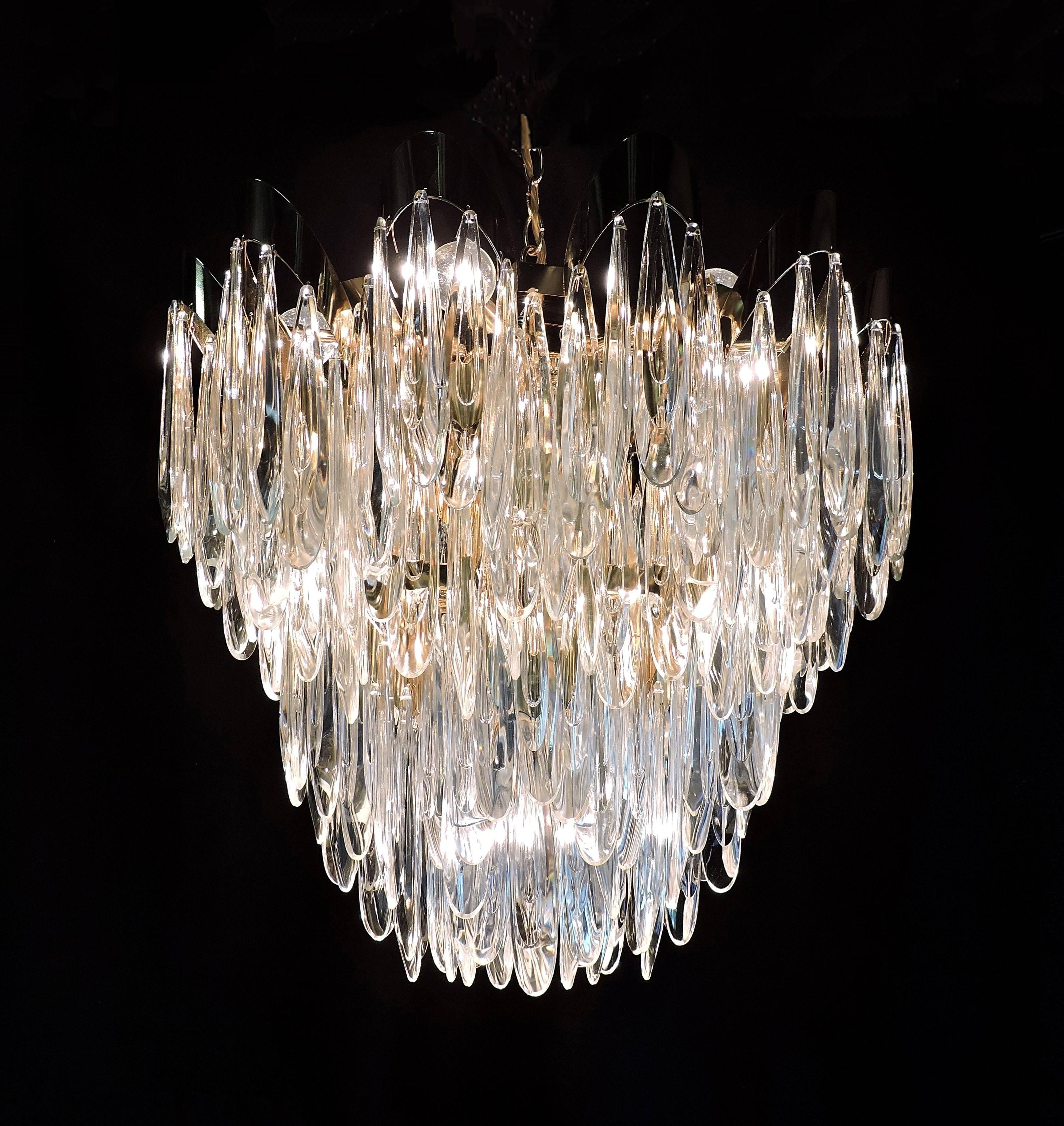 Lush and elegant chandelier by Lobmeyr. This large chandelier has over 200 tear drop shaped optical crystals that hang on a scalloped framework. Stunning in person.