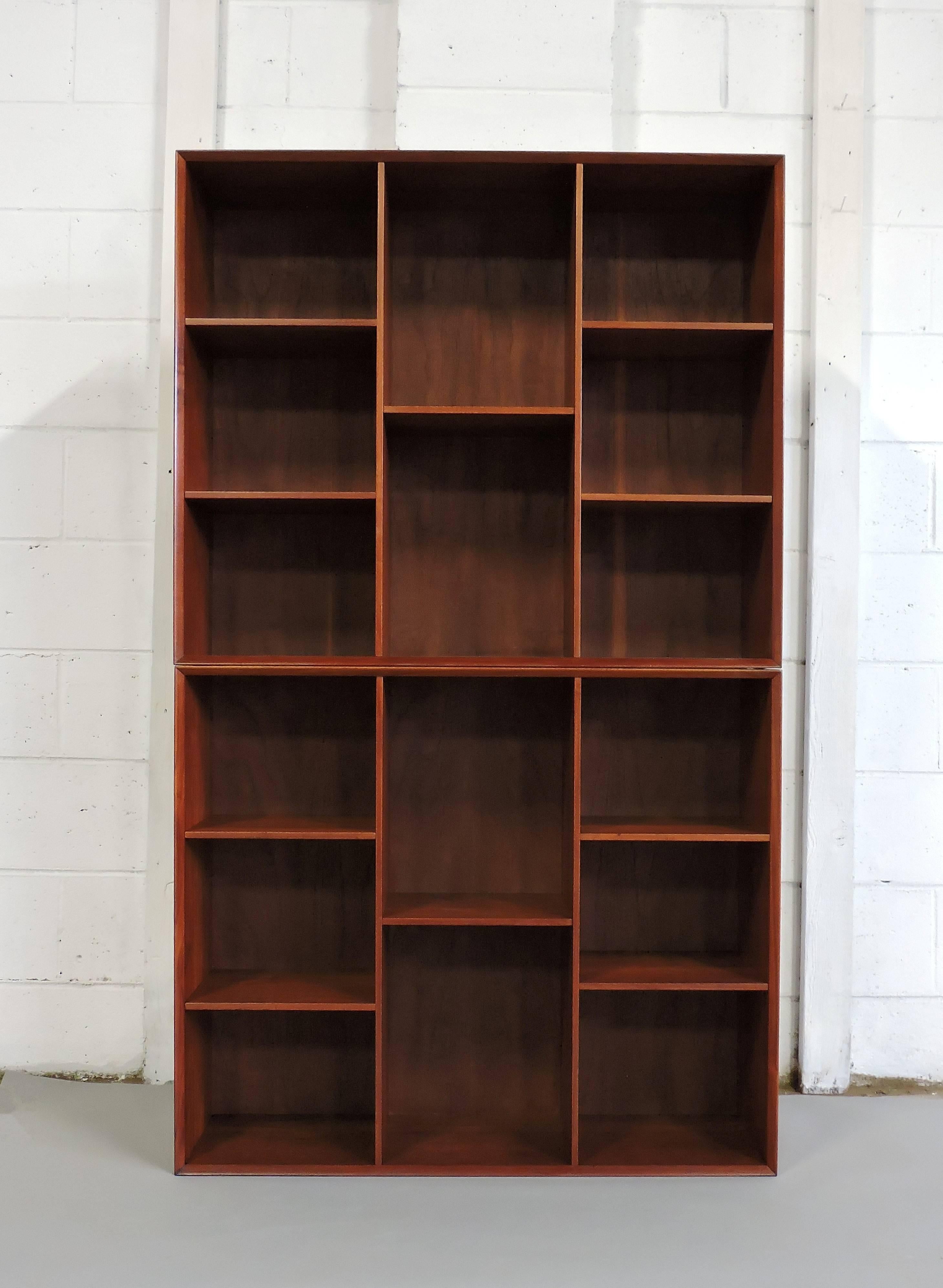 Handsome pair of bookcases designed by Peter Hvidt and Orla Mølgaard-Nielsen and manufactured in Denmark. These cabinets are made out of solid teak that has a beautiful grain and deep, rich color. Nice clean design and very well crafted with