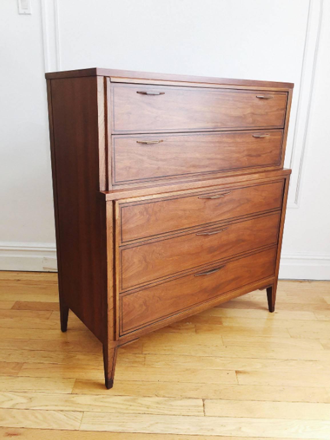 Art Deco-inspired, Mid-Century Modern highboy dresser from Kent Coffey's 'Tempo' line. Original sculpted pulls, inlay detail and contrasting walnut and elmwood. In excellent vintage condition, drawers are all clean and slide easily, no major
