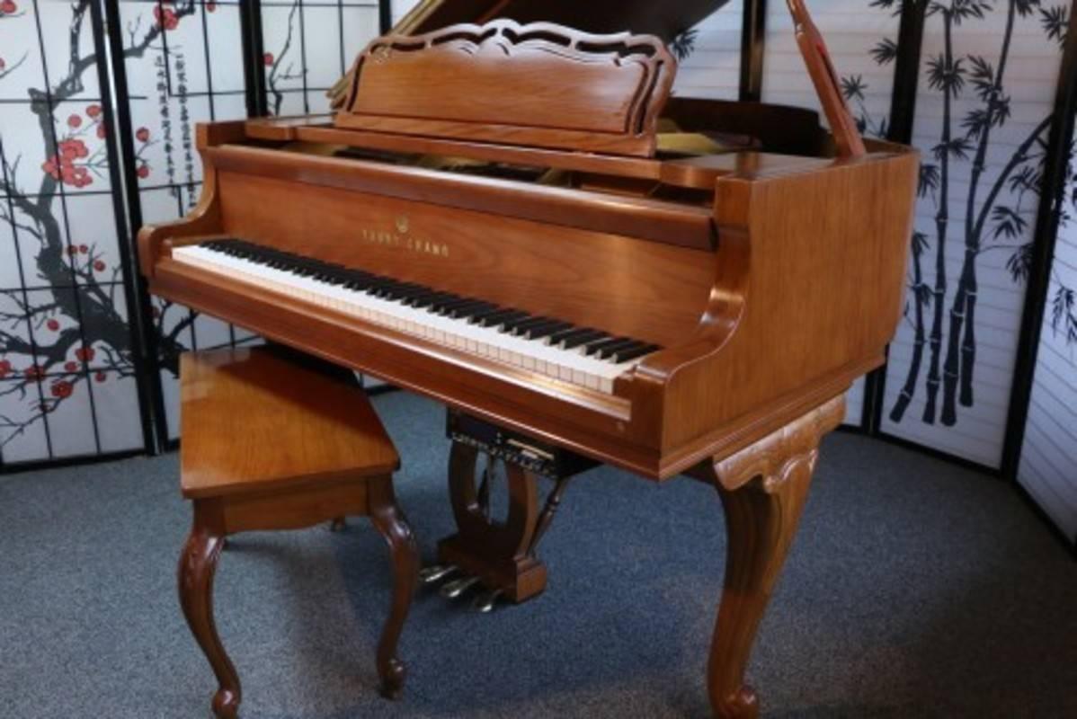 See and hear more about this magnificent piano on the video at the bottom of Sonny's Luxury Art case piano storefront homepage. 

Elegant, stylish, 1986, pretty, tan colored, oak grain 5'2