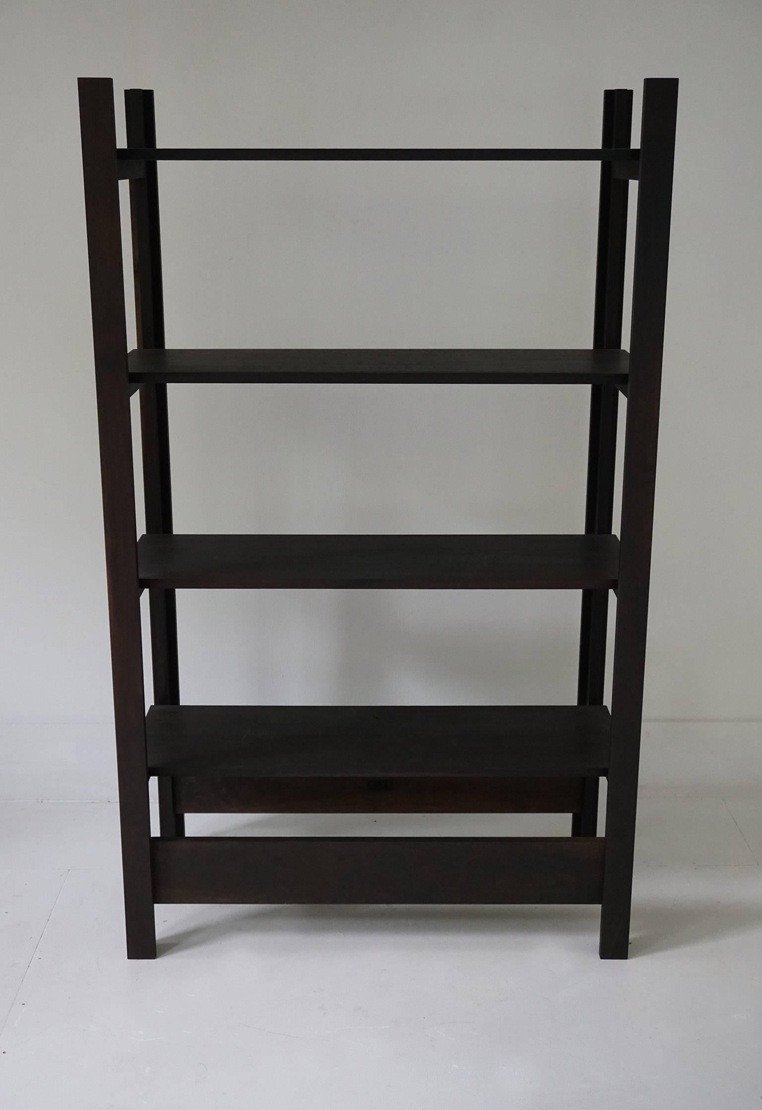 Upland shelving unit in oxidized walnut. Designed for display, books, and storage.