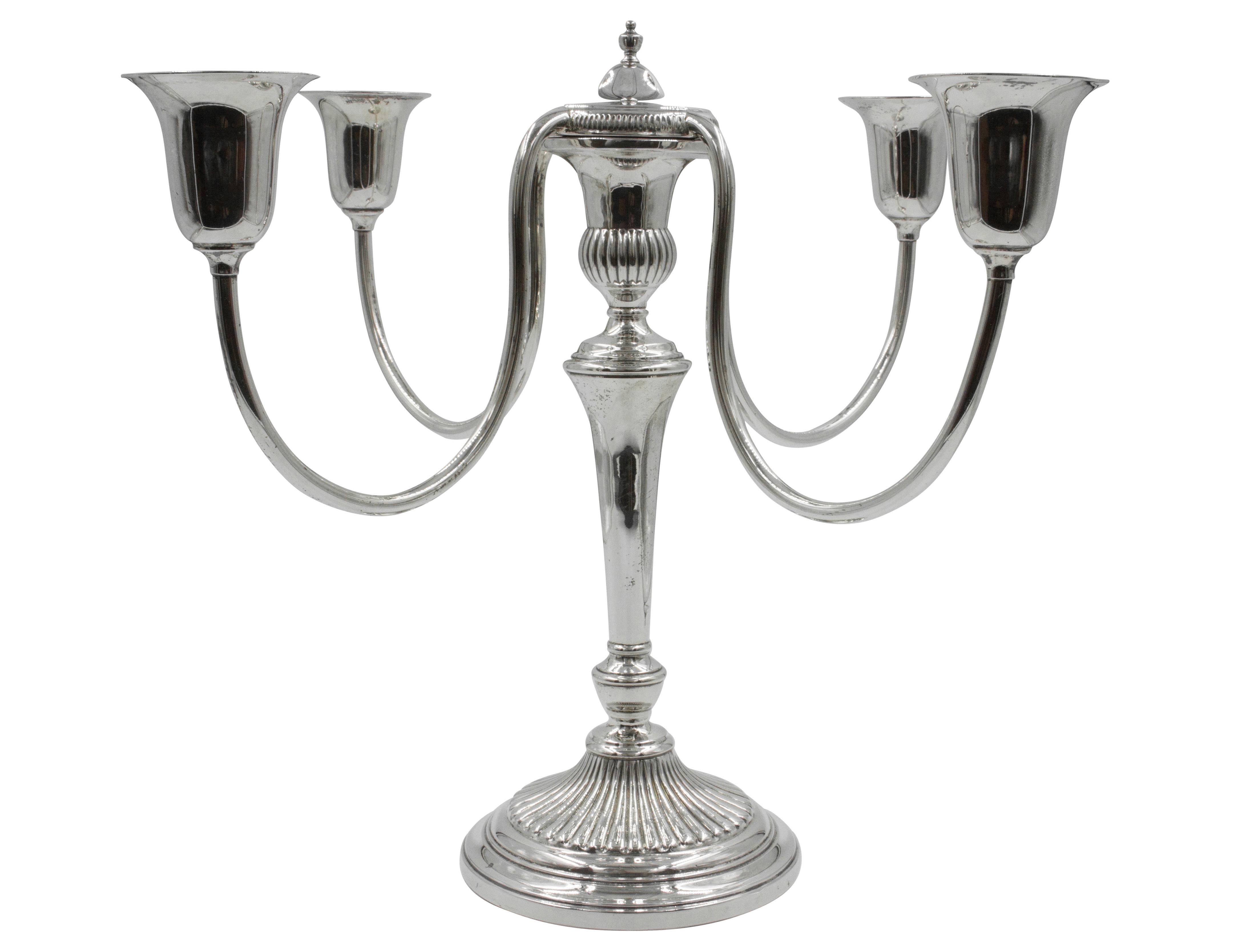 A pair of lovely five branch candelabras that would look great on a server or dining room table. The tops are removable from the body, making them easy to clean and store. Formal in appearance but without the ornate work, these candelabras are