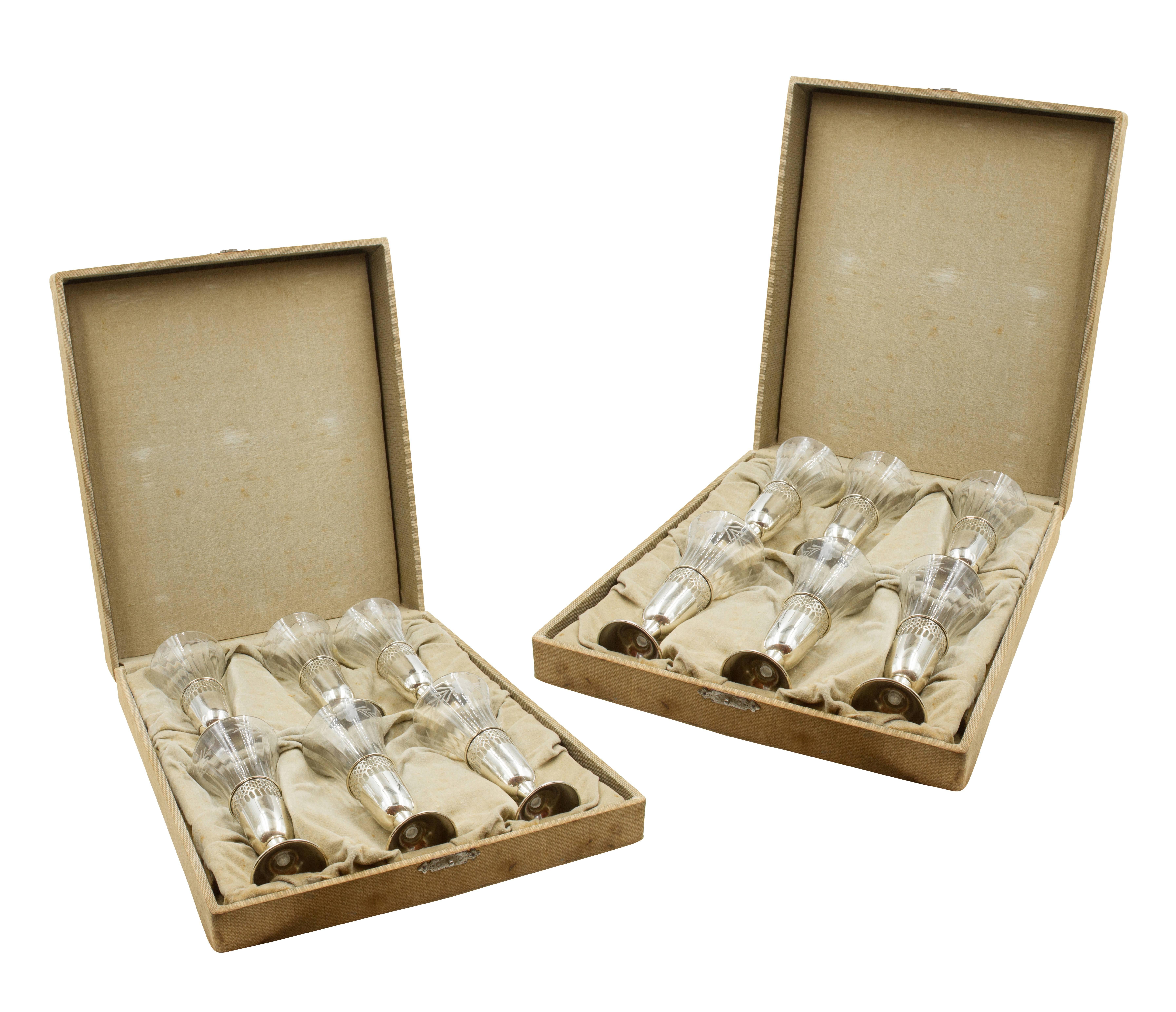A complete set of 12 is so hard to come by, but here you go: twelve perfect crystal and sterling Champagne/liqueur cordials. Original crystal liners fit into the sterling holders. Delicate etching encircles the entire top of the crystal while an