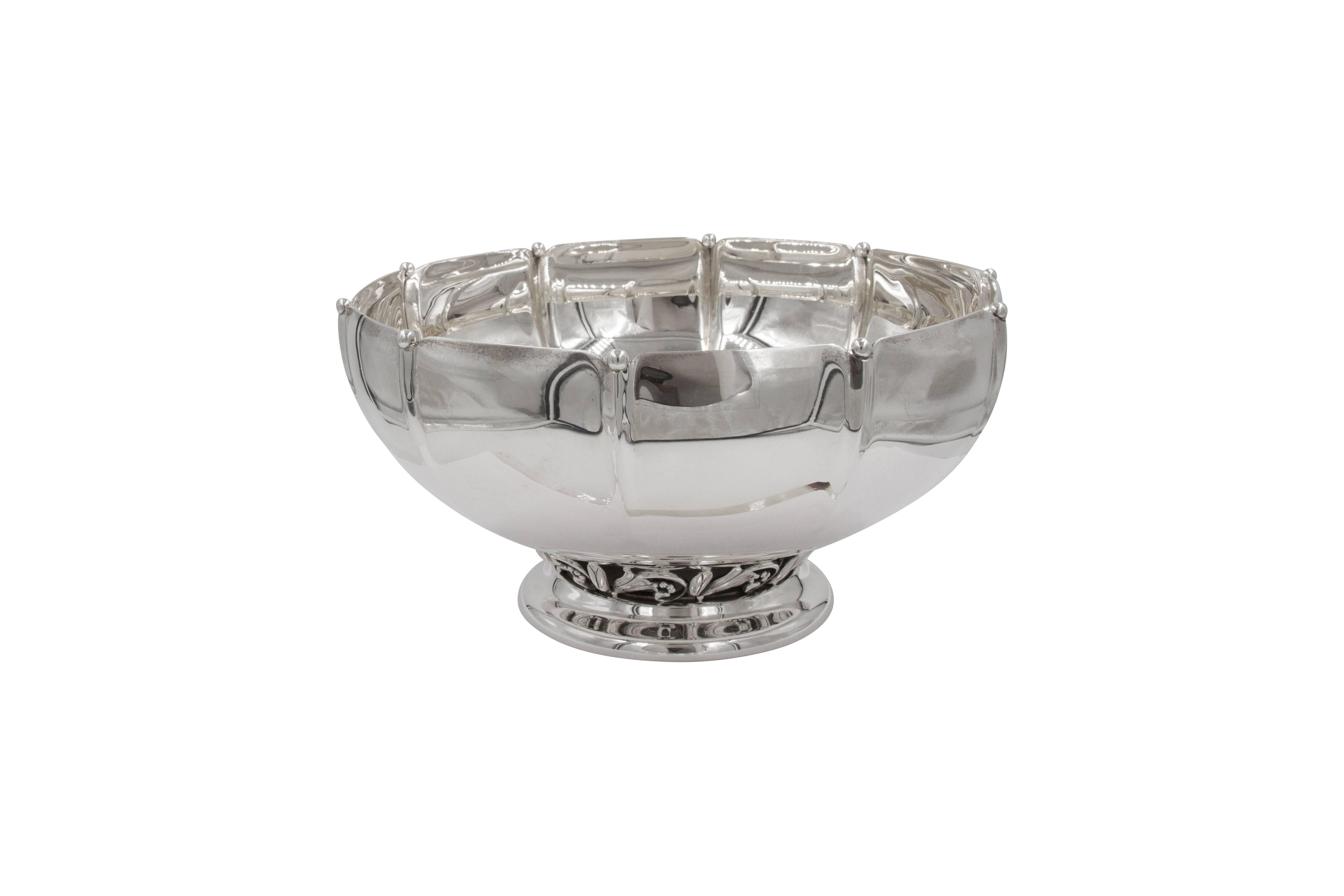 Proudly offering a three-piece suite by Hamilton Silver Company; a pair of candlesticks and matching centerpiece bowl. This Art Deco trio is quite fetching. The candlesticks are colonnade shaped and have cut-out work both on top around the neck and