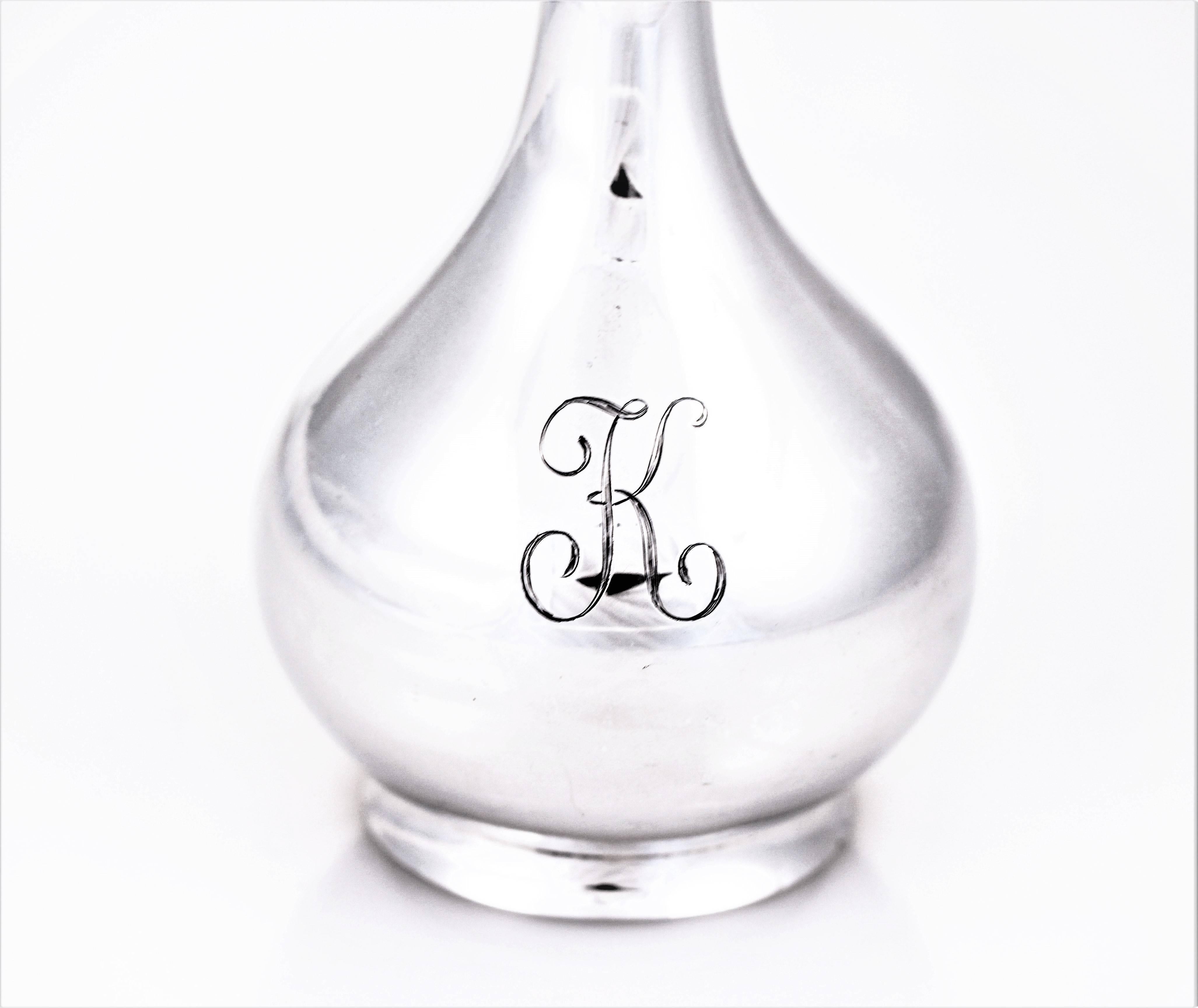 All the beauty is in the shape; the delicate femininity and scalloped top. The vase has a genie-bottle like shape with a hand engraved K on the belly. Imagine this beauty on your vanity or writing table, tres chic.
  