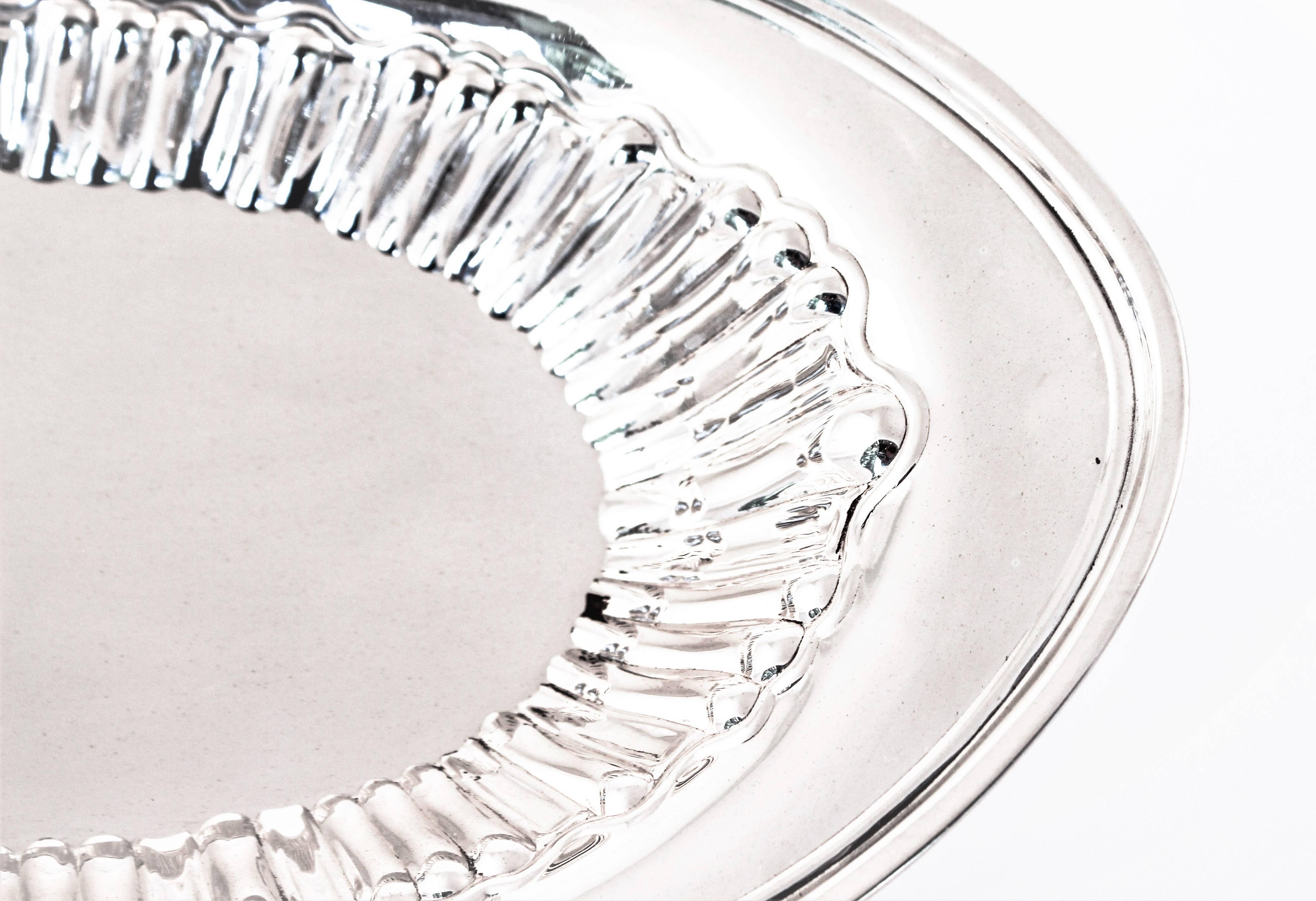 Ridges encircle the entire inside of this Art Deco breadbasket. A simple but truly functional piece of silver to have on hand.
 