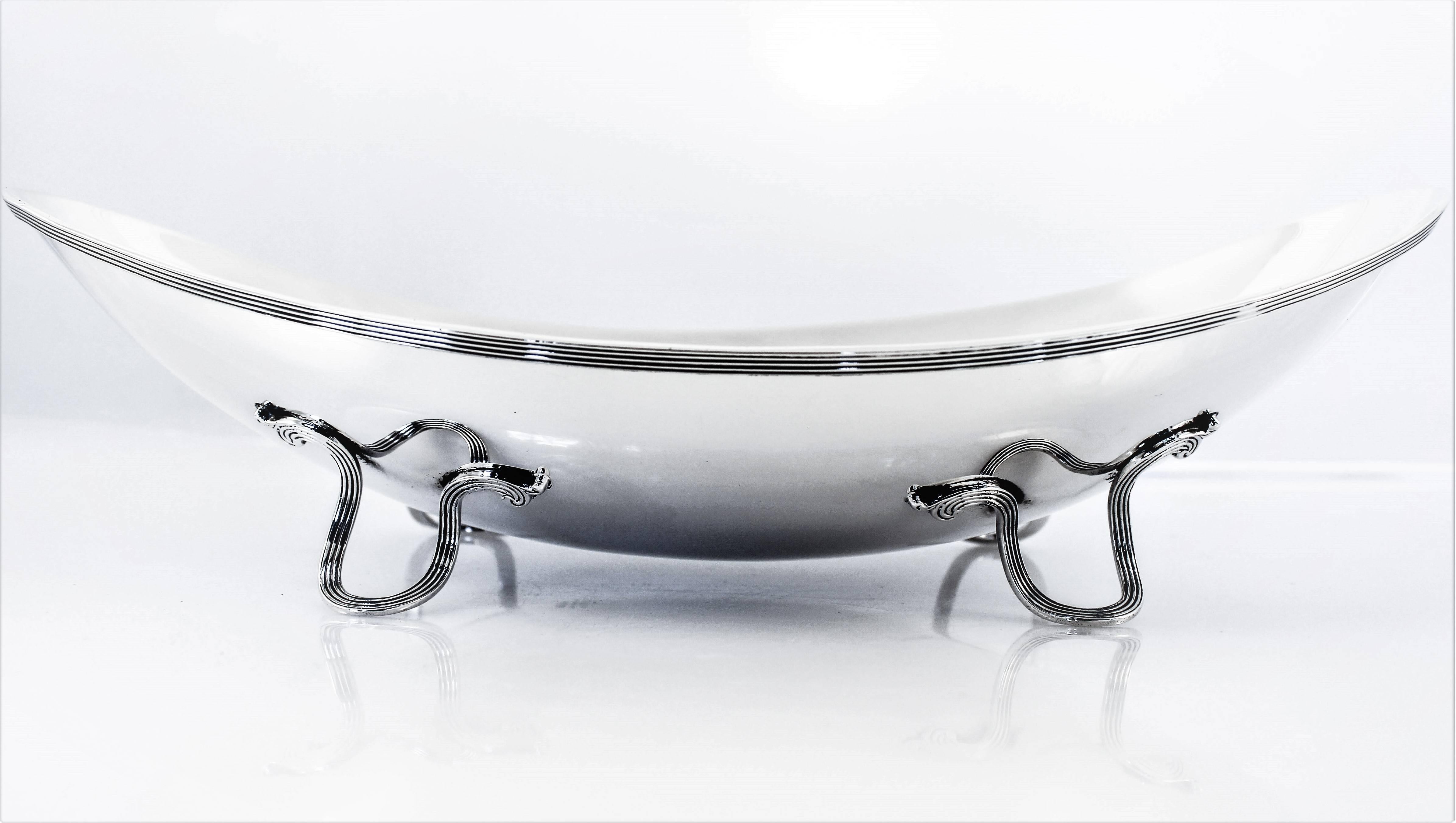 This piece may be over one hundred years old but it’s design and look couldn’t be more modern. Sleek oval shape with perfect curves sitting on four U shaped legs that have ribbing. This is the perfect piece to leave out on your coffee table.