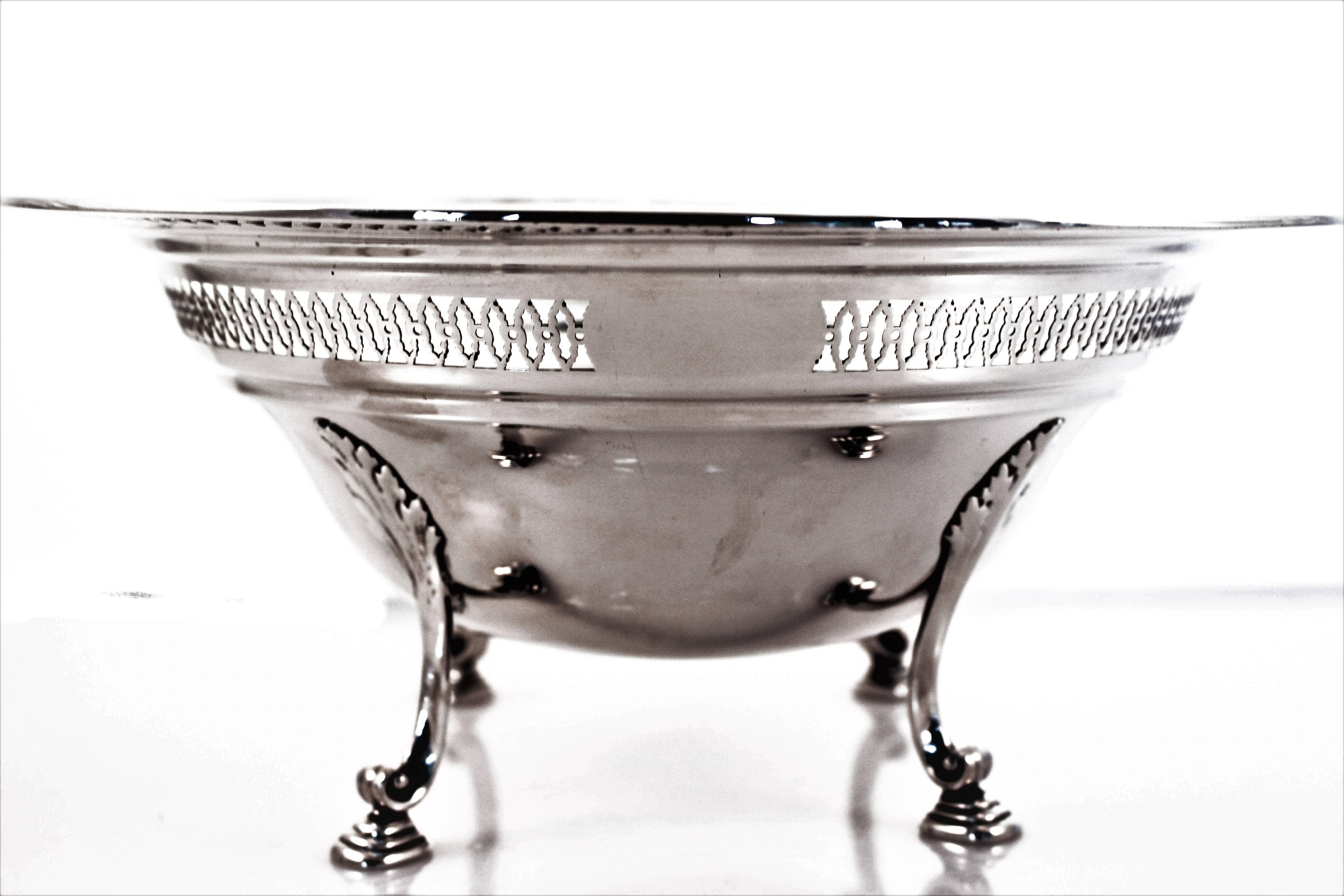 This bowl is quite unique. The bowl is raised an inch of the surface by the legs on each side. Towards the top a lovely pattern of oval shaped cut-outs encircles the entire bowl. Above that a lip with more cut-out work goes around the edge. It’s a