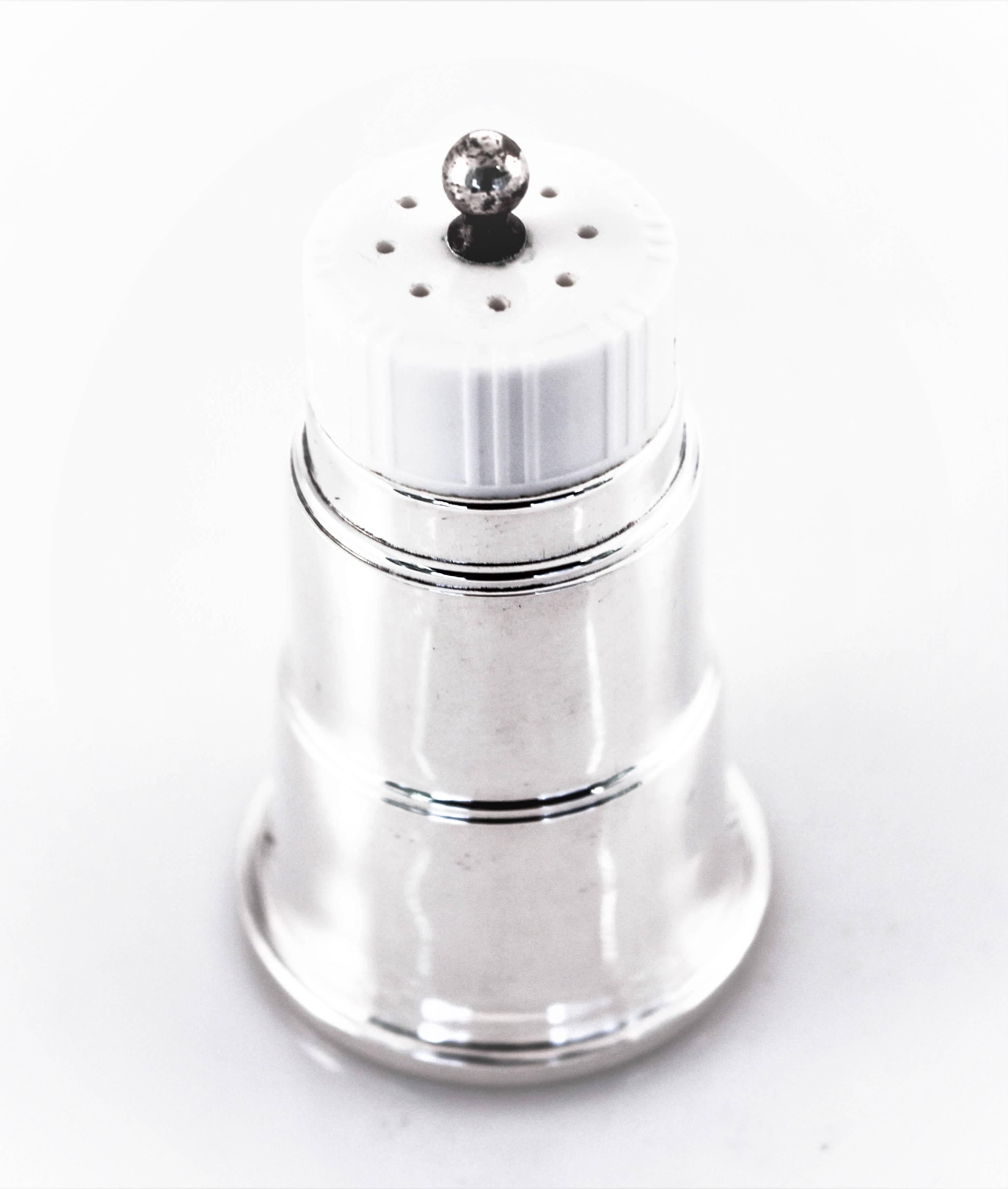 Retro is all the rage! These adorable salt and pepper shakers are quintessential mid-century in both form and style. The white top denotes salt and the black top, pepper. Glass liners allow you to keep them filled without any issues of pitting. So