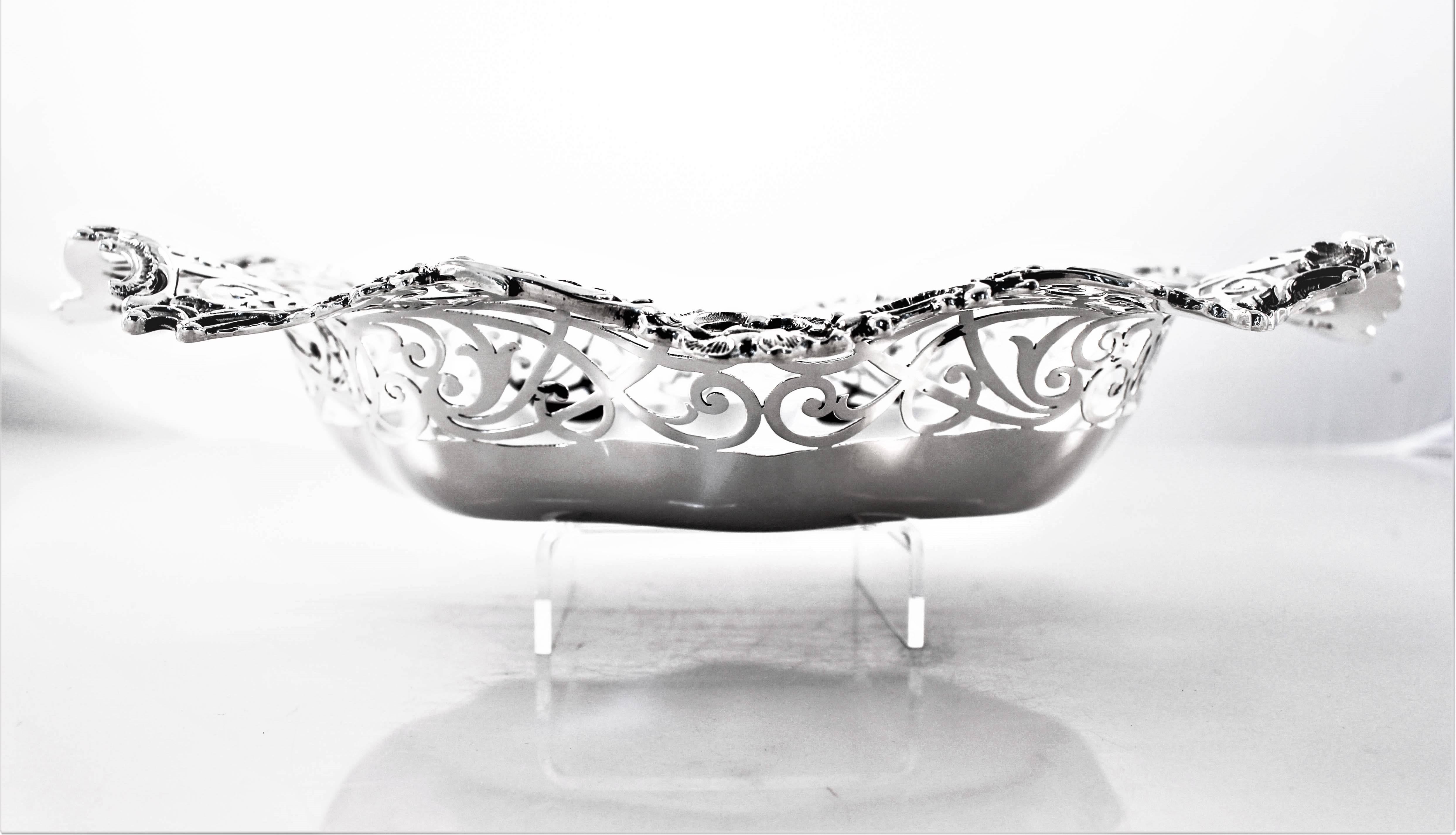 We took great pride in restoring this gem of antique silver. Every ding and scratch was meticulously removed, in the end we had the original piece as it was back in 1893. A scalloped rim with open-work and the original hand engraved monogram in the