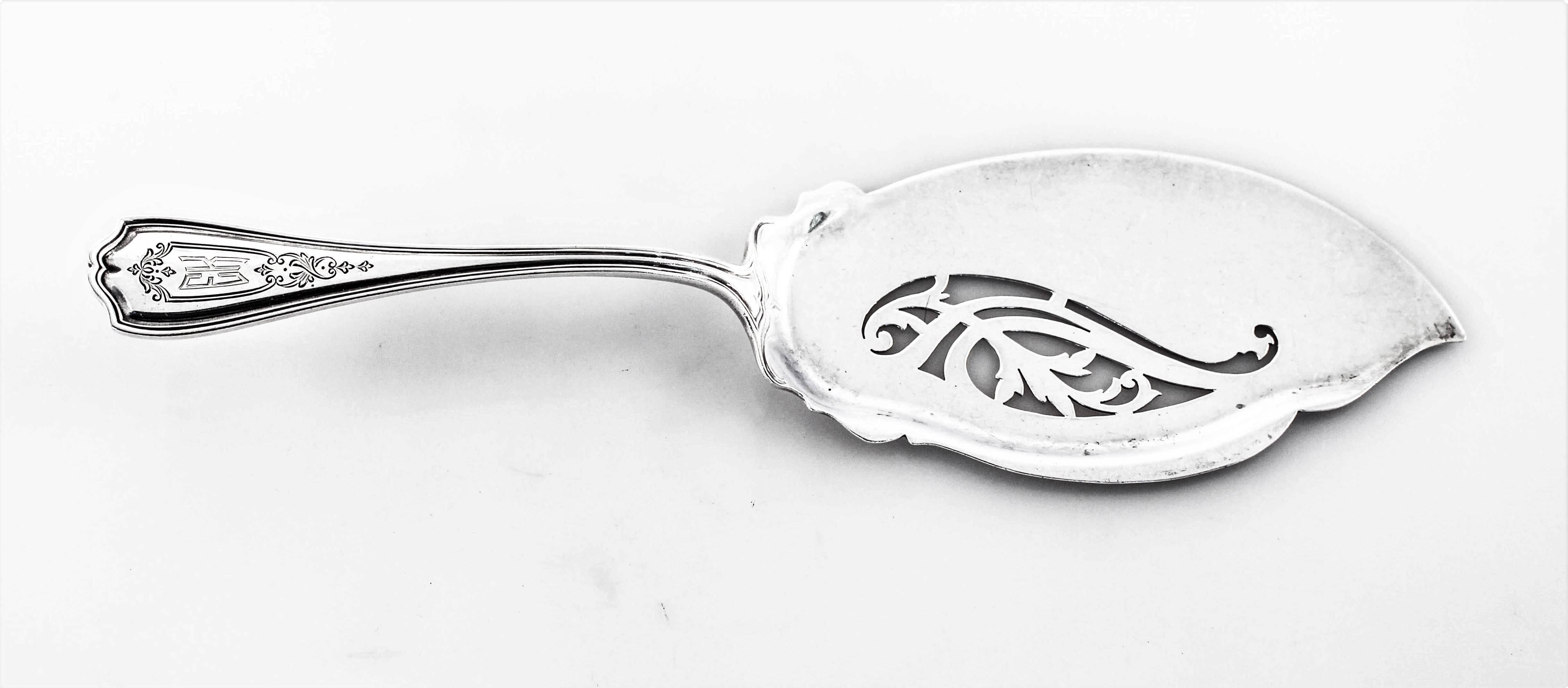 The fork and server have chased work on their handle and pretty cutout work towards the top. On the fork, a diamond-like cutout nestled between the tines. On the server, a paisley shaped cutout compliments its shape. A hand engraved monogram of EK