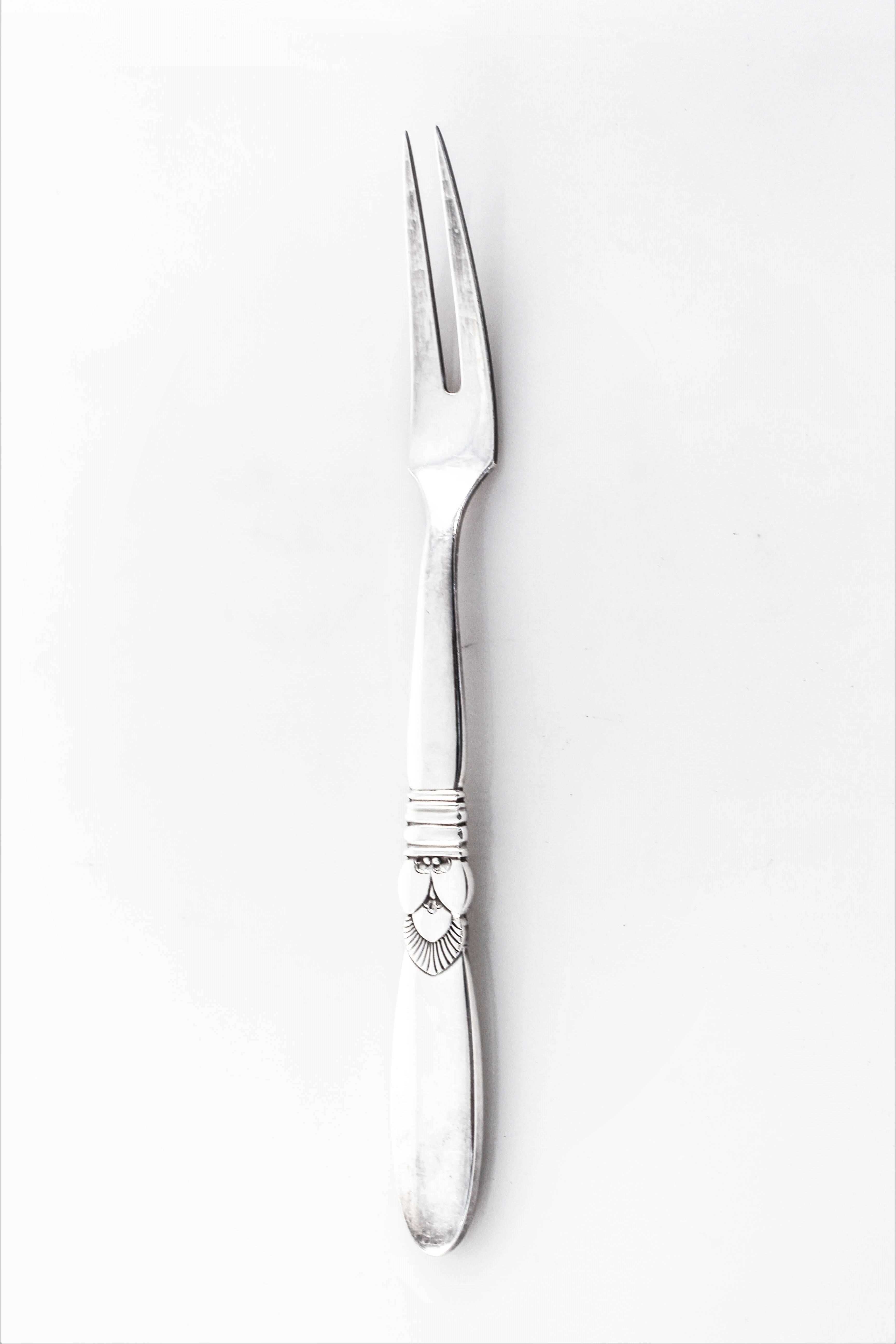 Cactus by Georg Jensen, an iconic pattern from a master silversmith. The look and craftsmanship that is distinctively Jensen. A (meat) fork and serving spoon, use together or apart.
 