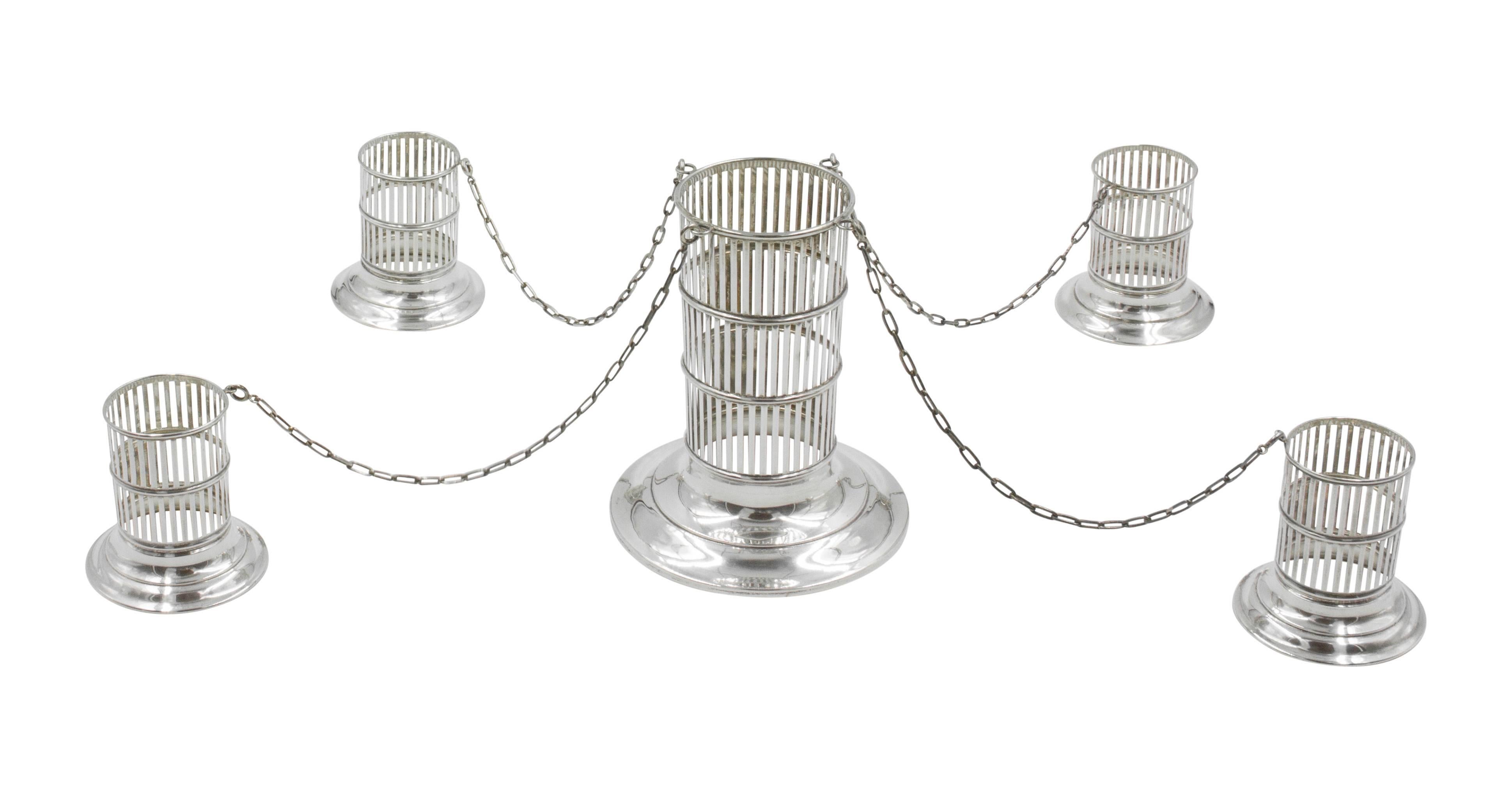 For those that want the rare and unusual, listen up, this is for you! A vase in the center with four matching smaller vases connected by a sterling silver chain. This would make a beautiful centerpiece on your table, or remove the chain and use the