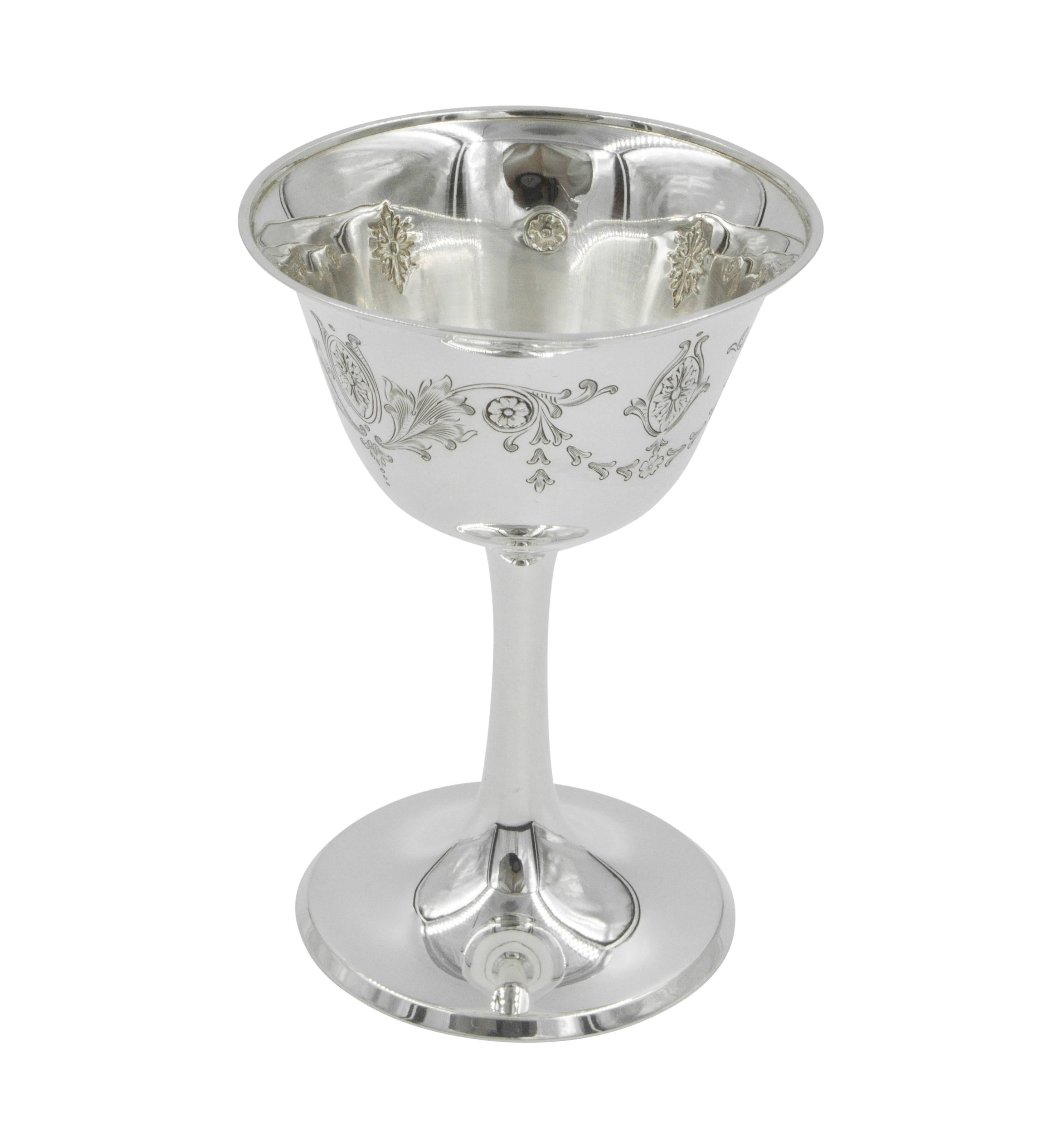 Presented here is a lovely set of 12 dessert cups. Dainty garlands and medallions are etched around the top part while the stem and base are modern.