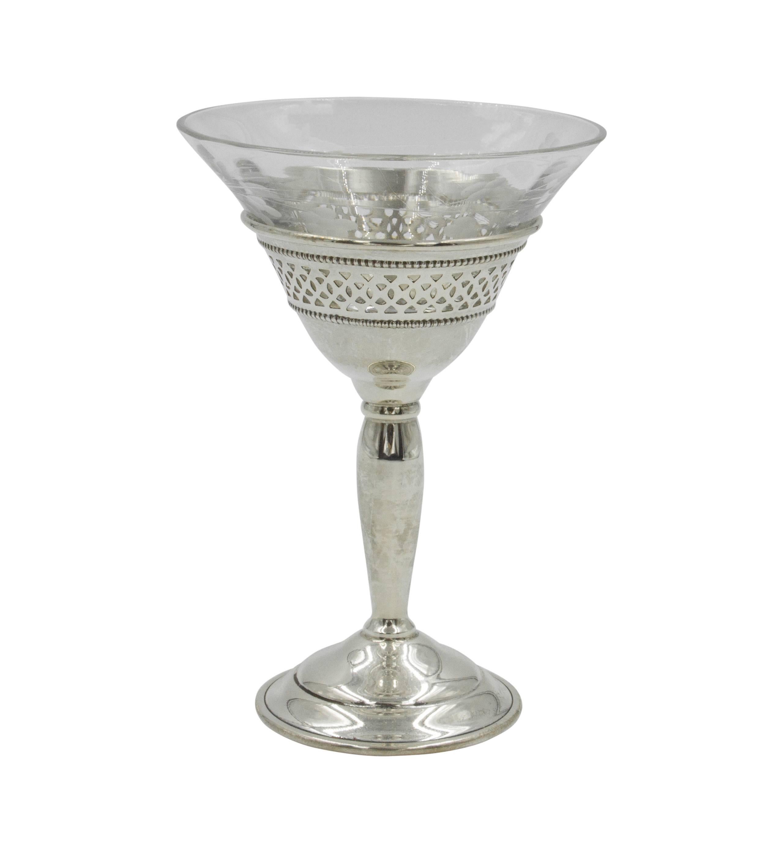 Proudly offering a set of 18 cordials made by Elgin Silversmiths. These lovely cups are meticulously made; the crystal screws into the sterling base. The glass cannot fall out. Delicately etched flowers go around the crystal. The sterling base is