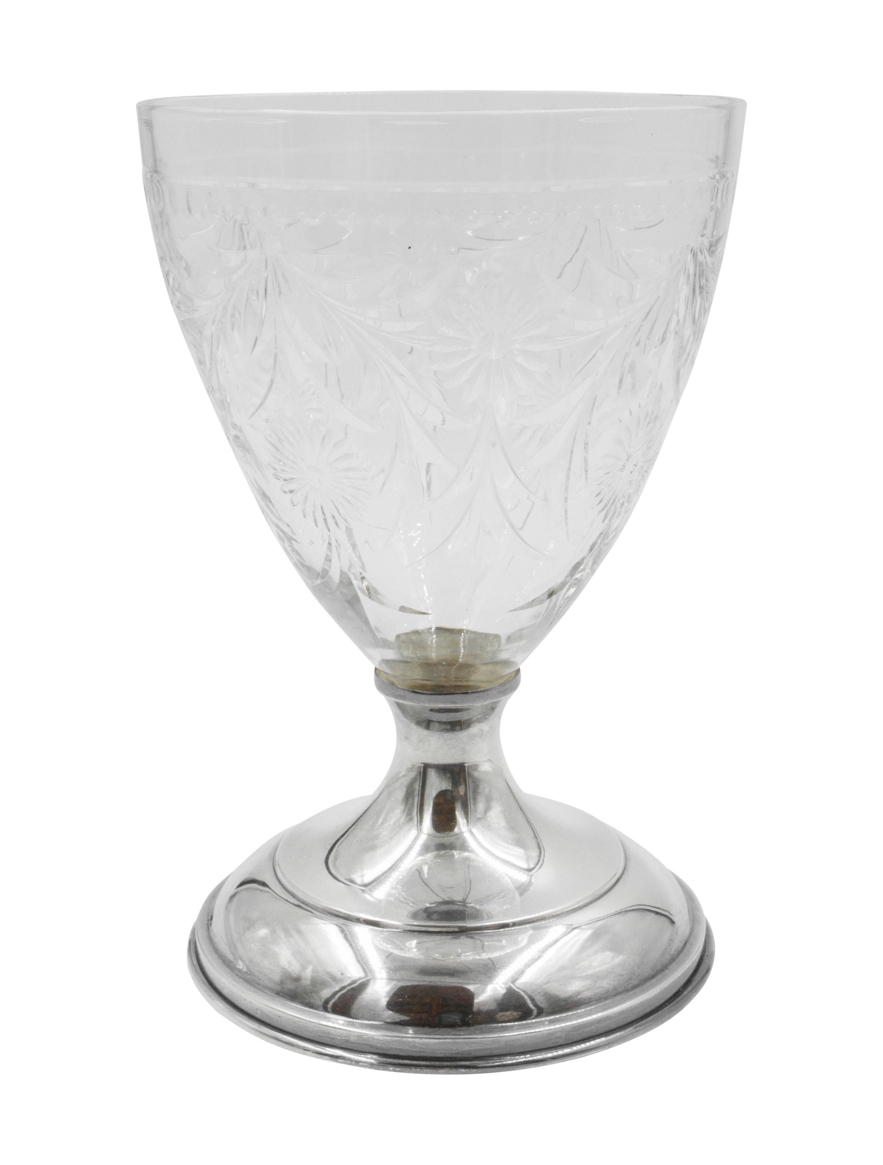 We are so proud to offer this breathtaking pair of crystal urns with sterling silver base and top. Old-world elegance etched throughout the body and cover of the urns; sunflowers and garlands cut into the crystal. These would look lovely on a coffee