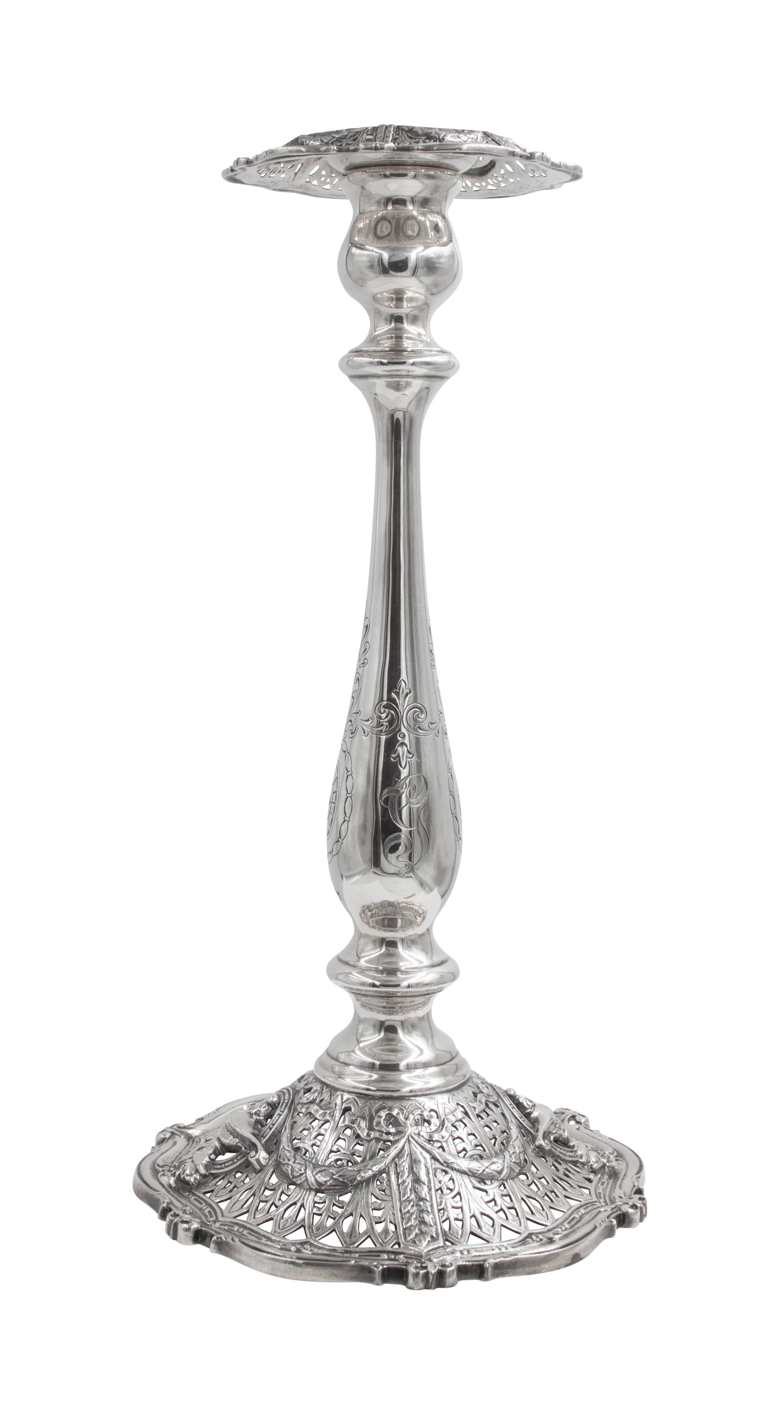 Old world grace and elegance are yours for the taking with this magnificent pair of vintage silver candlesticks. Delicate floral engraving along the base and stem lend a majestic feel to these extraordinary statement pieces. A unique expression of
