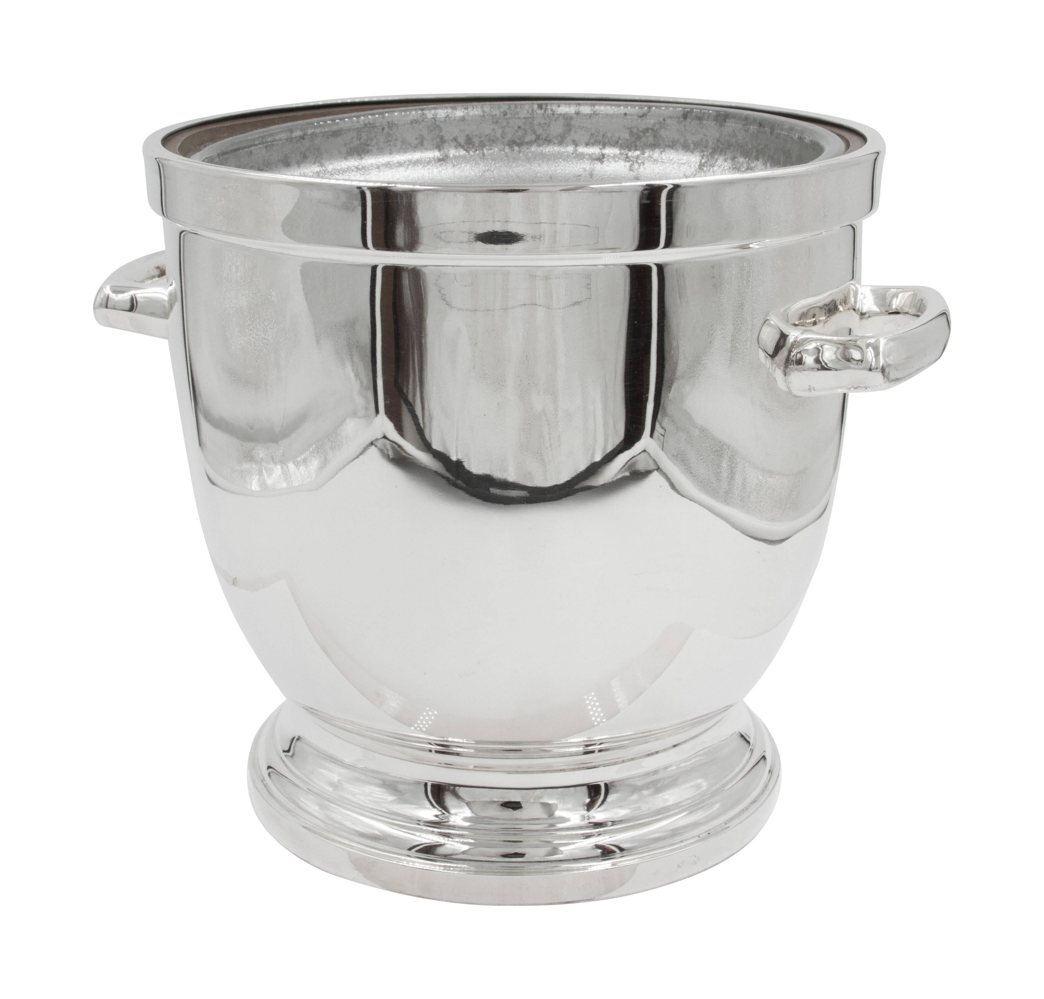 This Mid-Century Modern ice bucket is super sleek and quintessential of that period (Mid-Century). Great for entertaining; would look great on your bar or server.