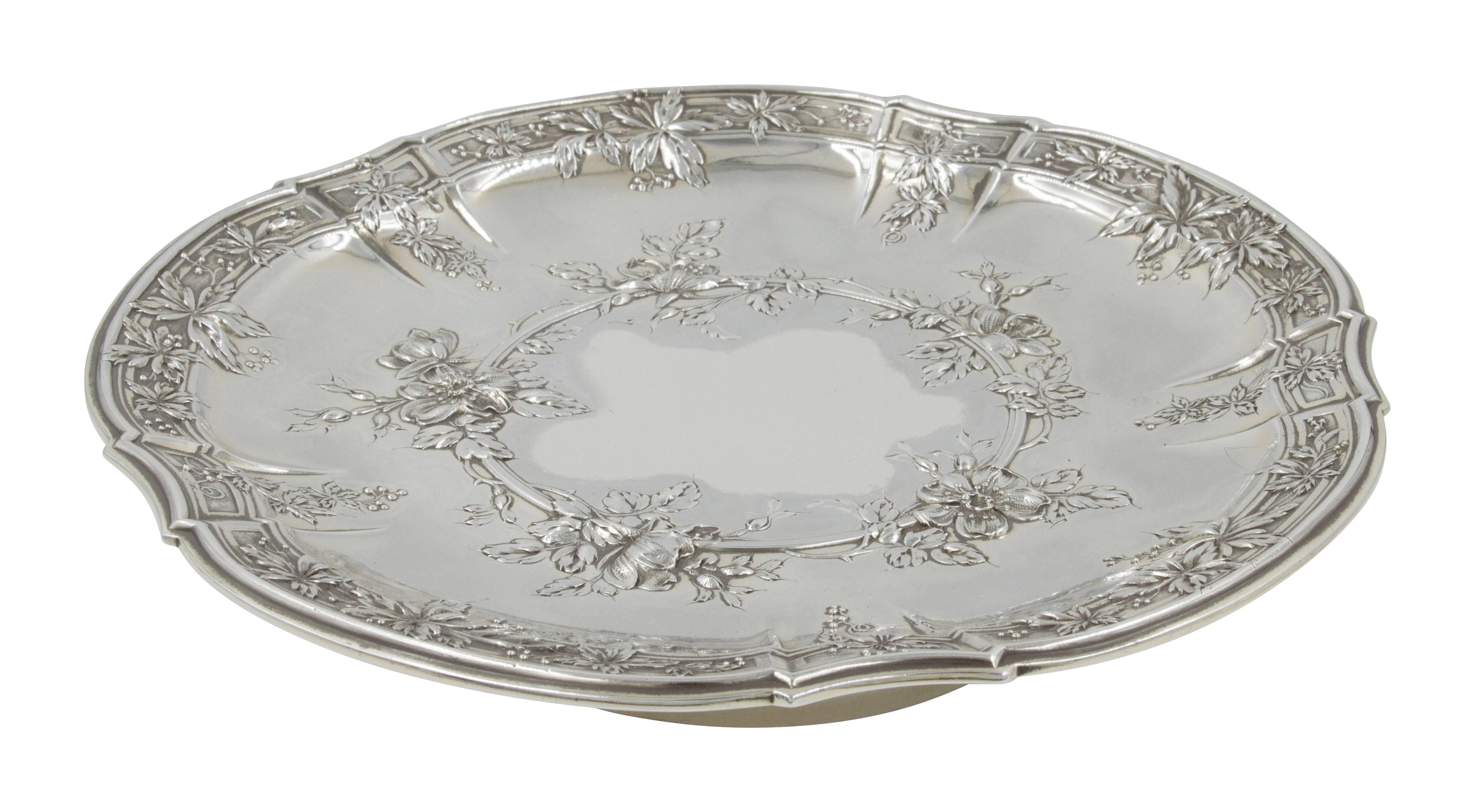 This dishes have scalloped rims and sit on pedestals giving them height. They have lovely raised flowers and vines decorating the outer border and inner-center reminiscent of the days of Louis XIV and Versailles. The perfect size for pastries and