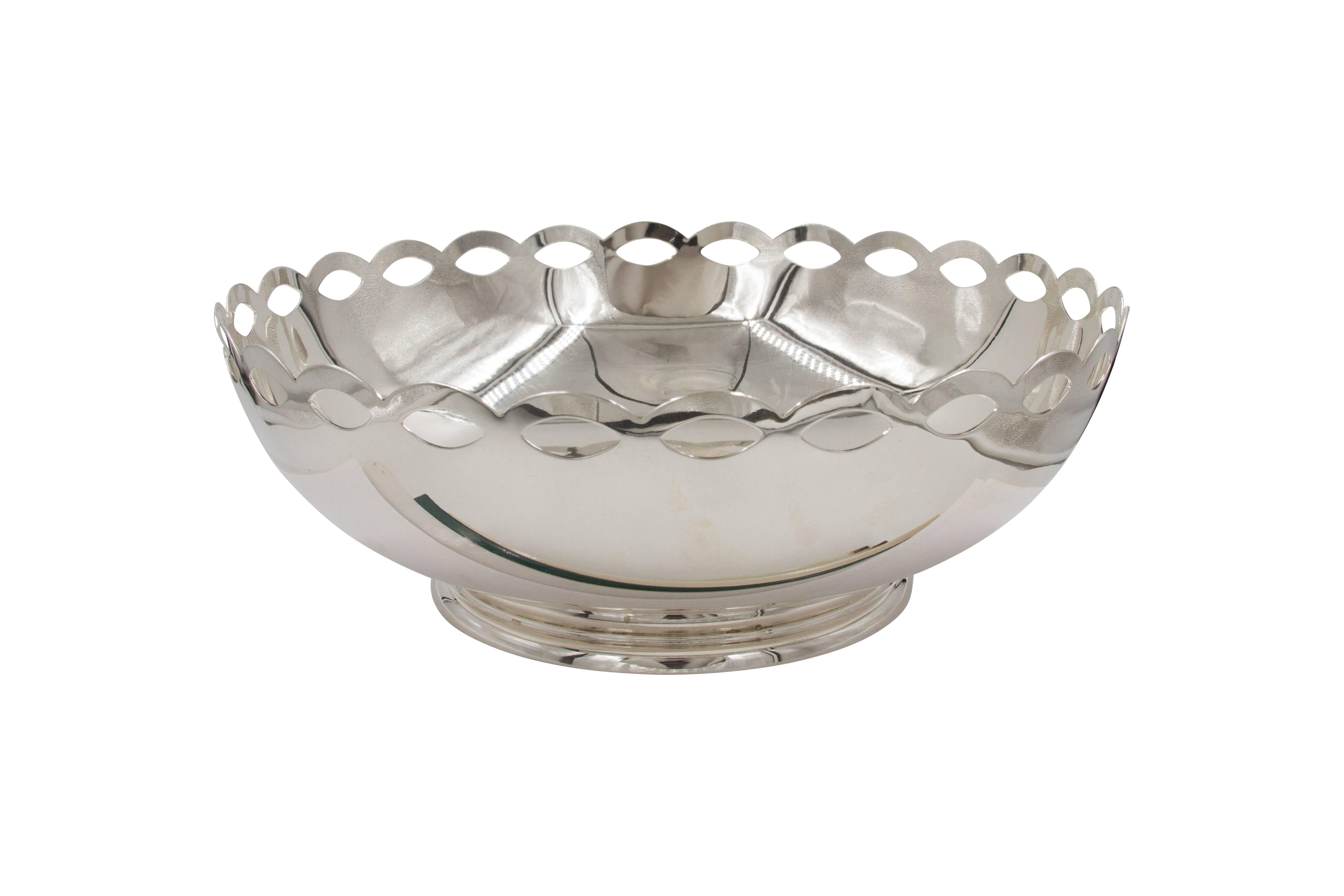 This bowl is the Quintessence of modernism and the very best of Mid-Century design. We love the symmetric cut-out pattern that wraps around the entire top. It gives this otherwise plain bowl a real sharp and handsome look!