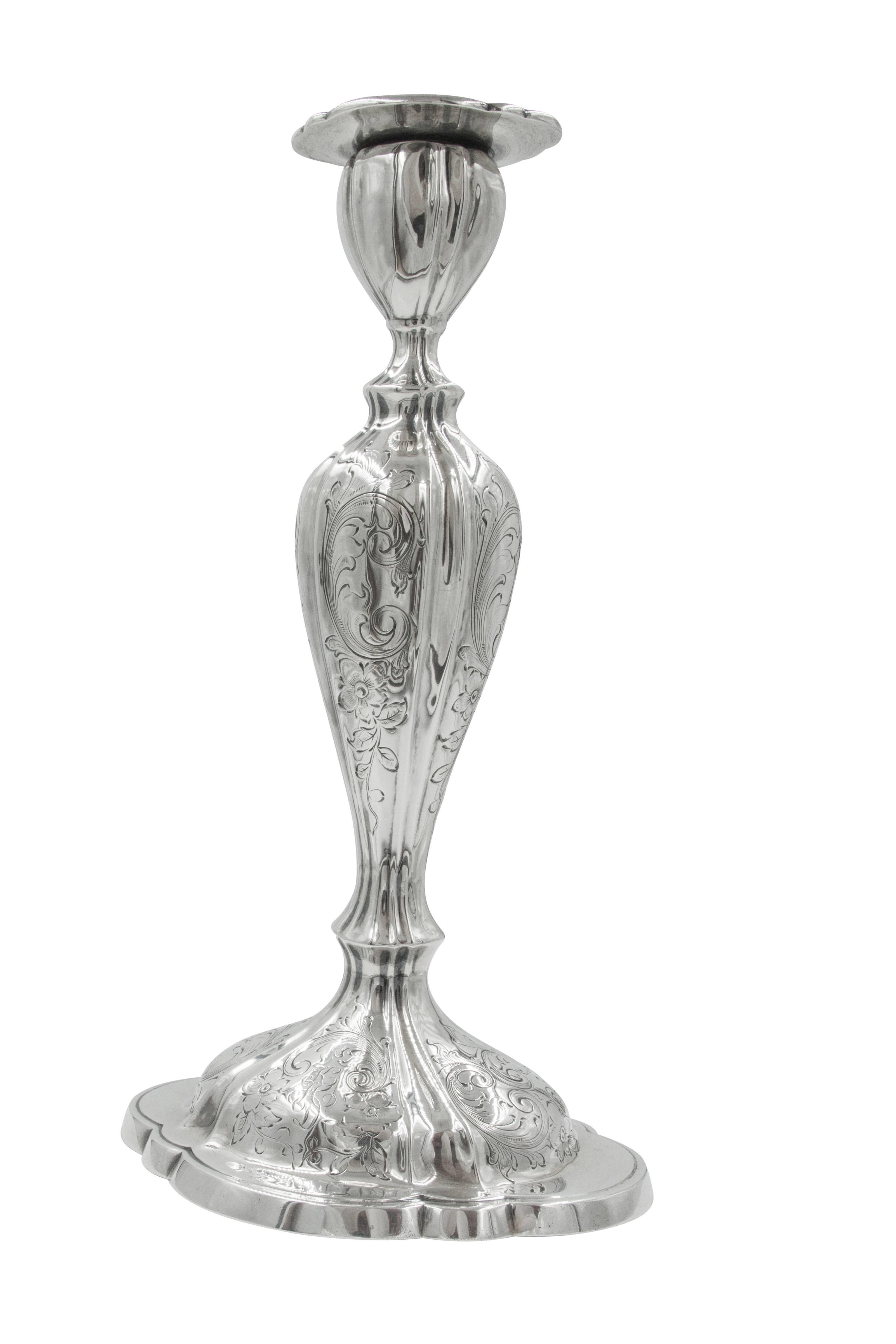 These 111 years old candlesticks have grace. There's a gracefulness to them that is unique, maybe it's the floral etching that decorate not only the body but also the base, or maybe it's the feminine, curvy Silhouette? Whichever you think, we know