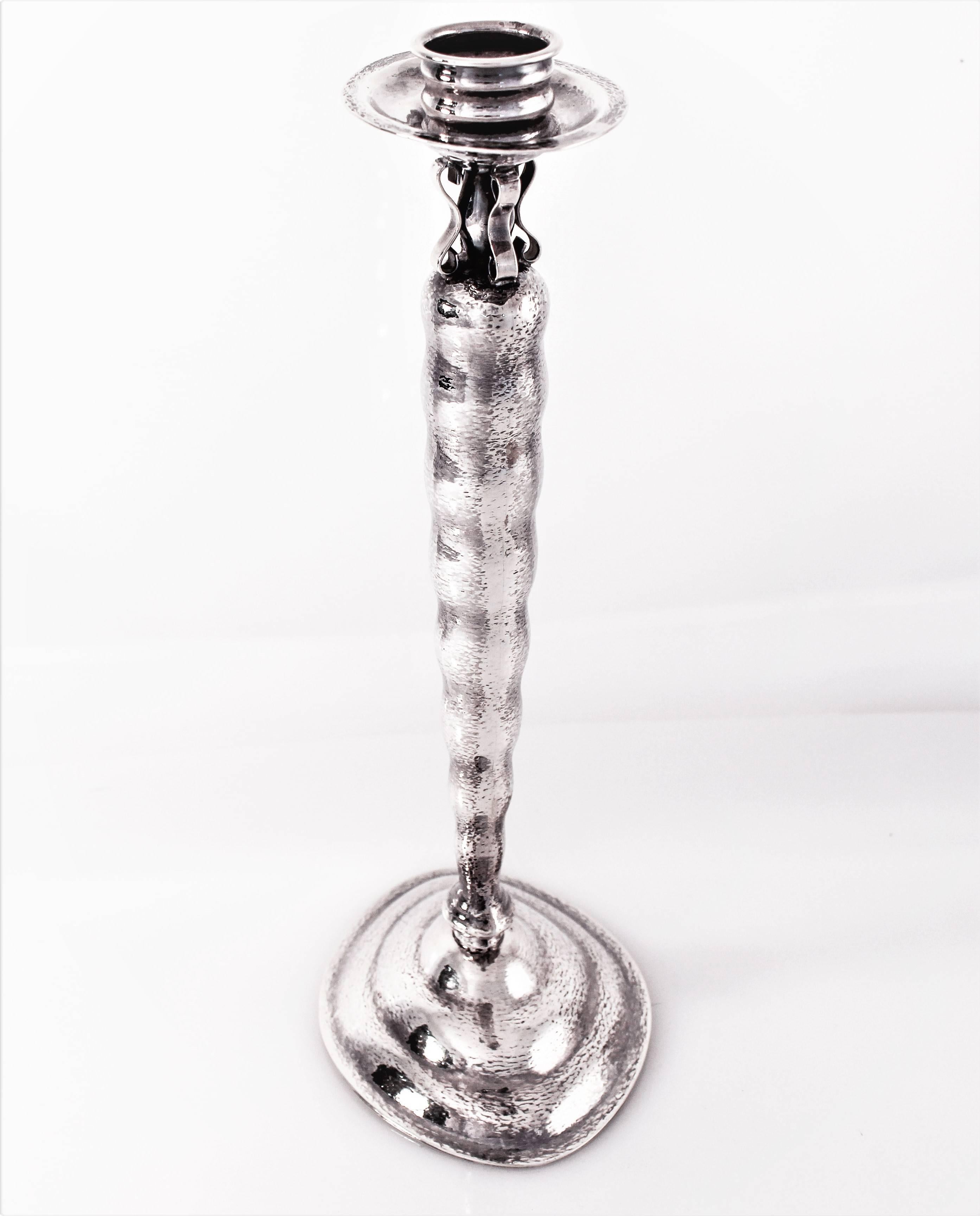 If you like drawing outside the box, if you don’t want to have what everyone else has, keep reading. These candlesticks are uber-cool; they have a hammered futuristic design. Oval base and top with ridges along the entire body. There are also four