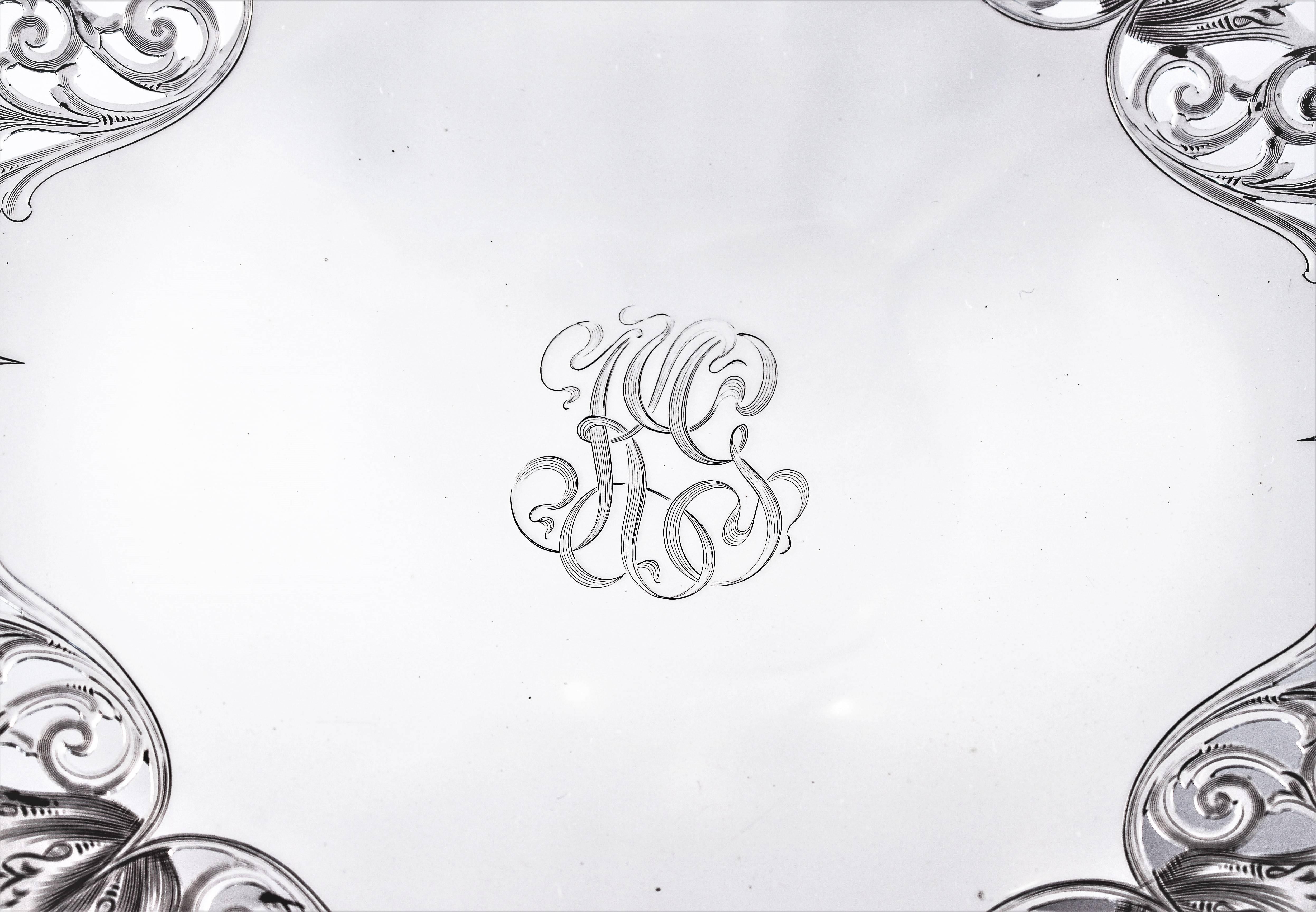 Resting on a center pedestal, this dish has delicate openwork around the corners. But don’t let the openwork fool you, this is a heavy solid piece. We also love the hand engraved monogram in the center.