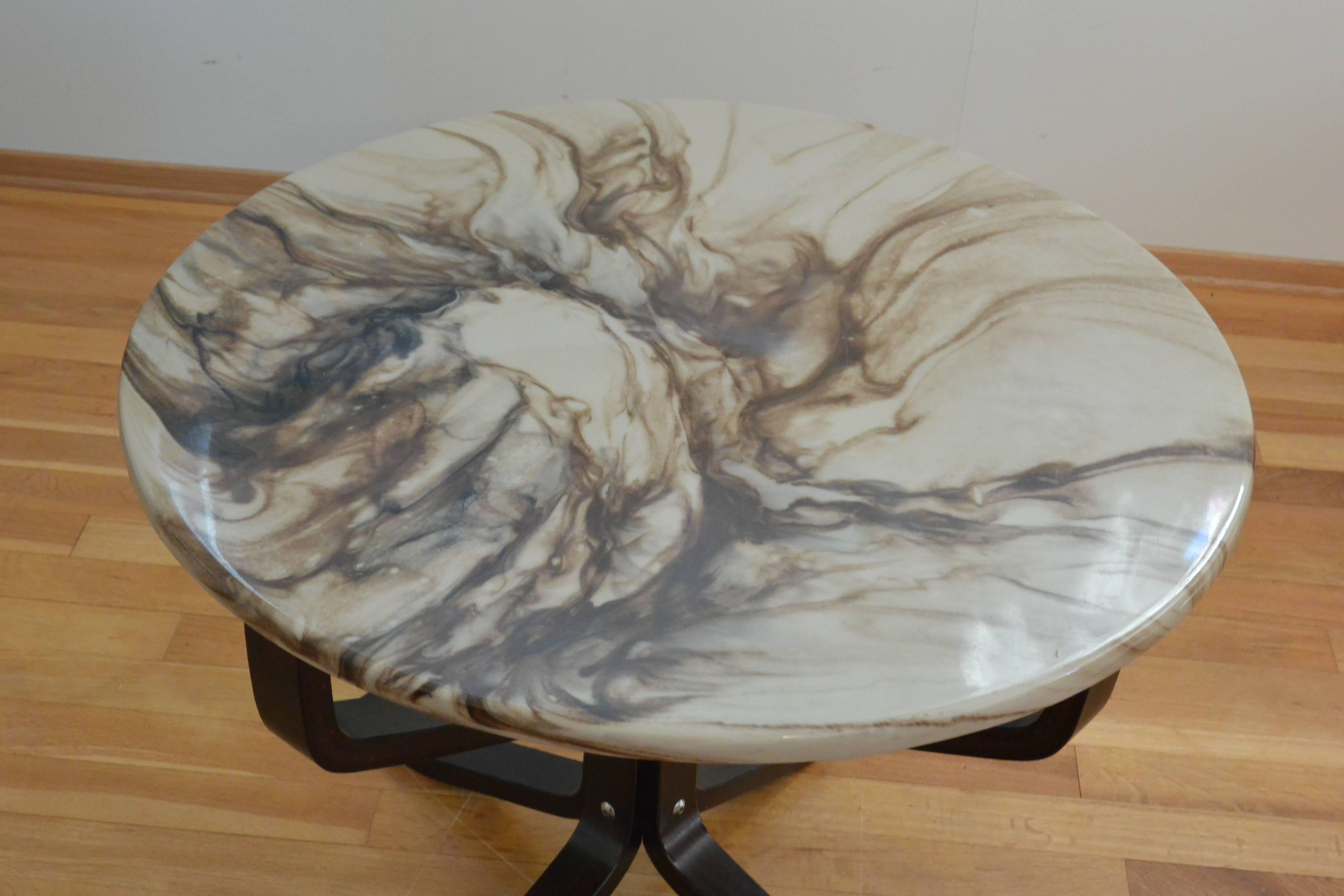 Marble composite falcon table made designed by Sigurd Ressell for Vatne Møbler, Norway, late 1970s.

The composite marble-top is made from marble powders and resin to creating the strong marble effect table. (70% marble powders/30%resin, making it